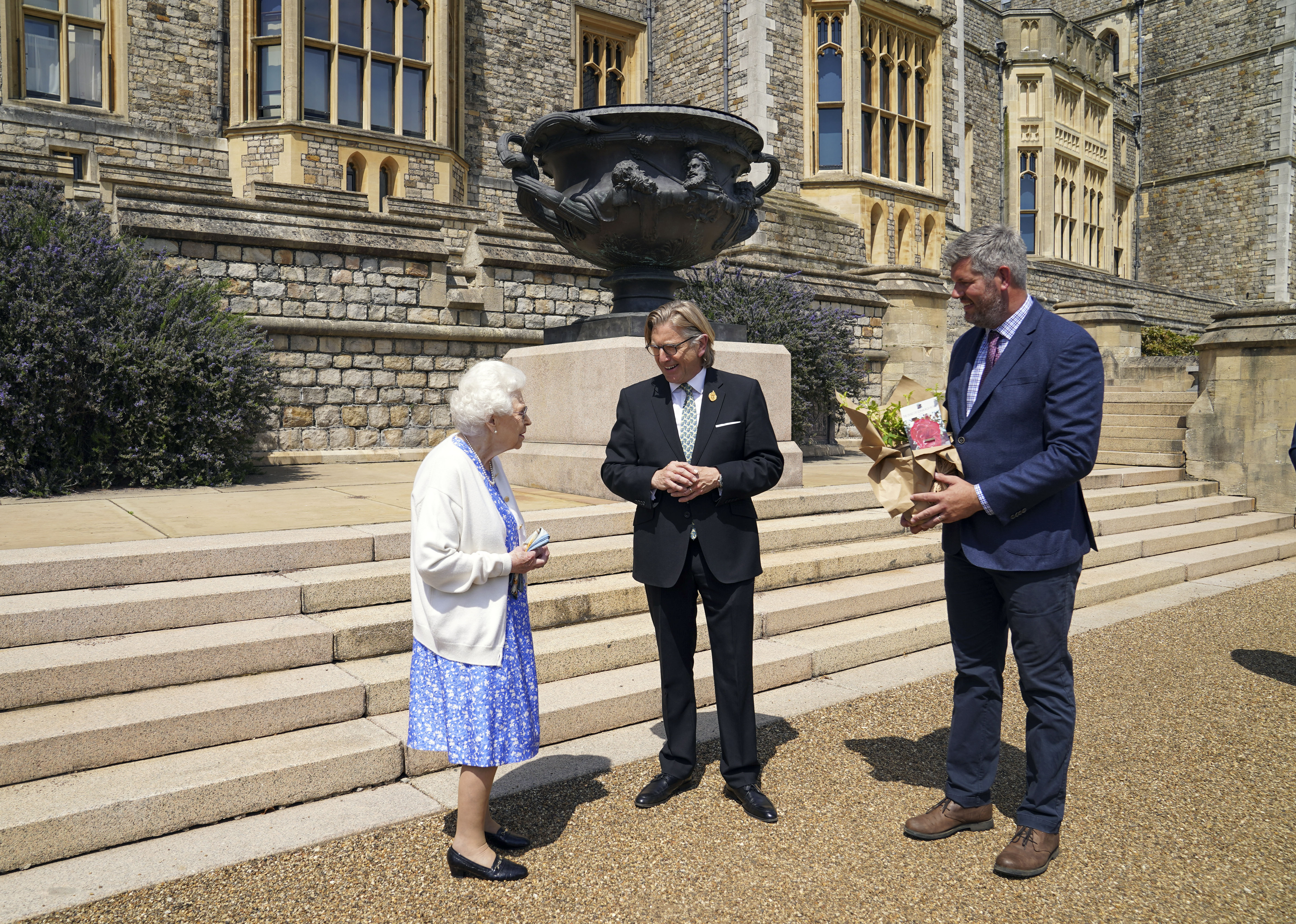 The Queen chatting about the gardens with the RHS president and Windsor's head gardener