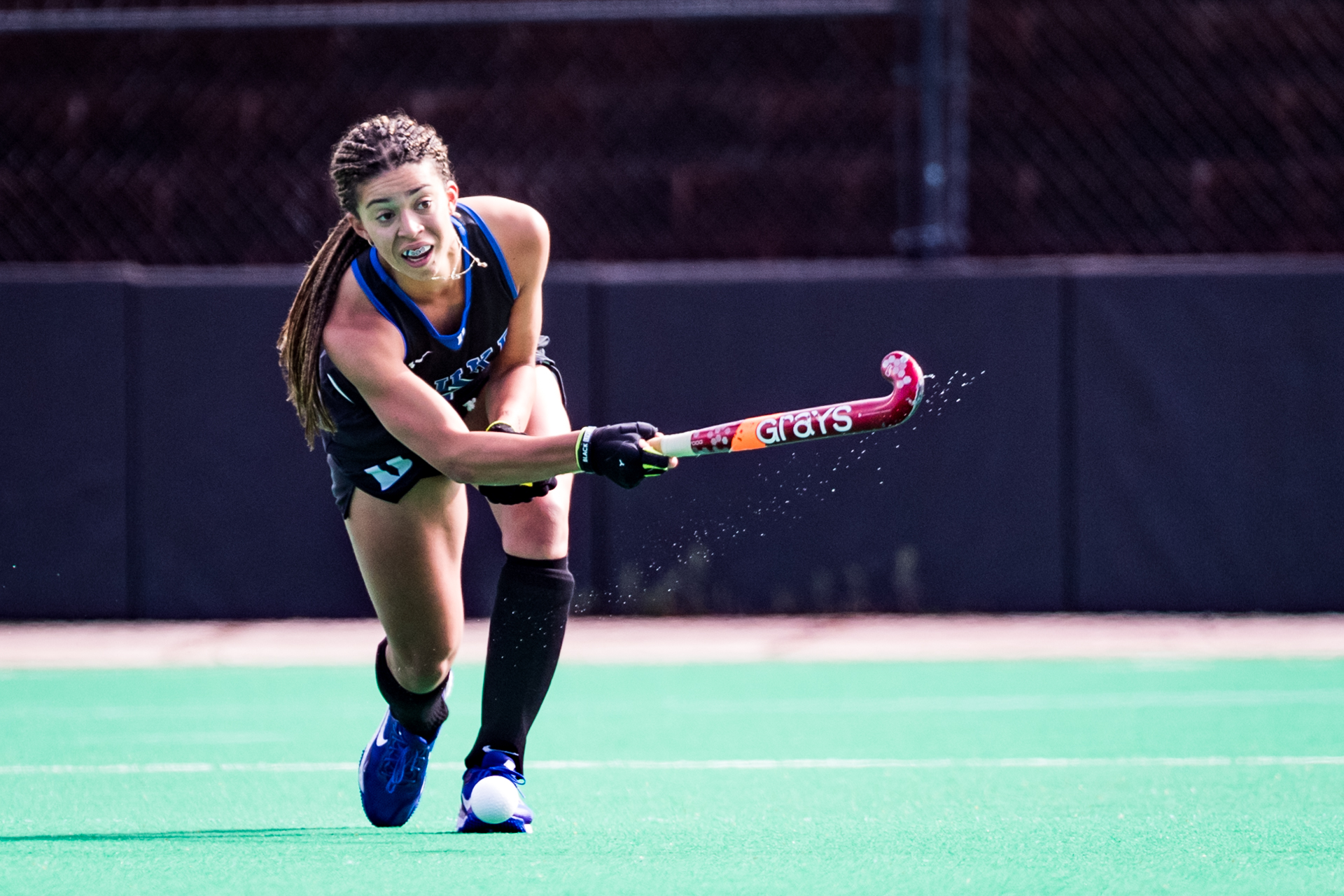 Darcy Bourne hits the ball playing for Duke University