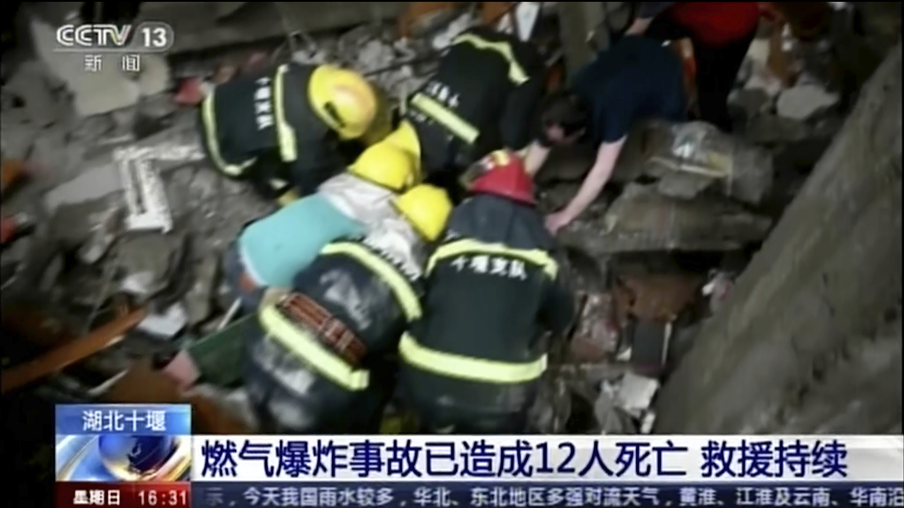 Rescue workers at the scene after an explosion in Shiyan city
