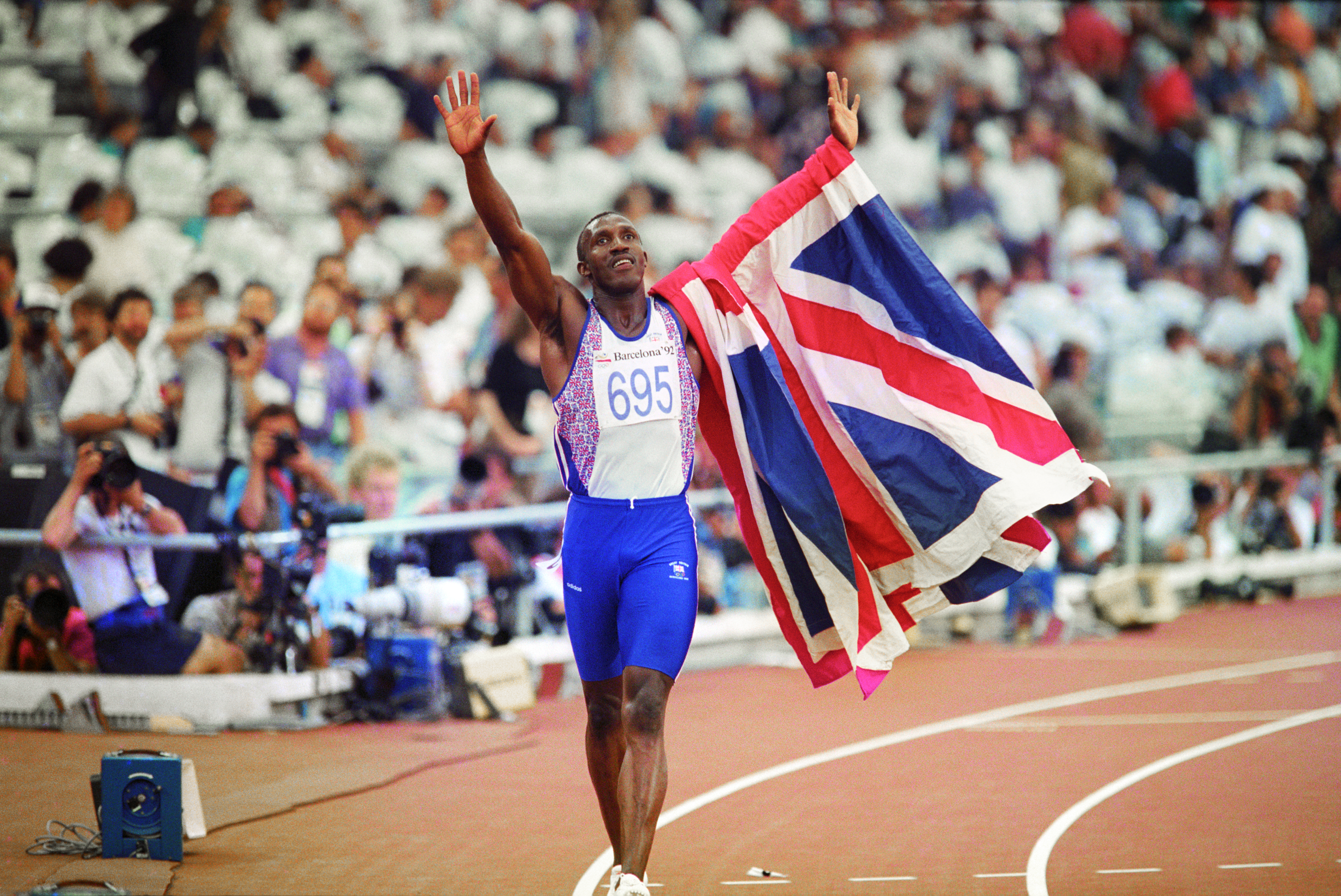 Linford Christie celebrates victory in the 100m final at the 1992 Olympics