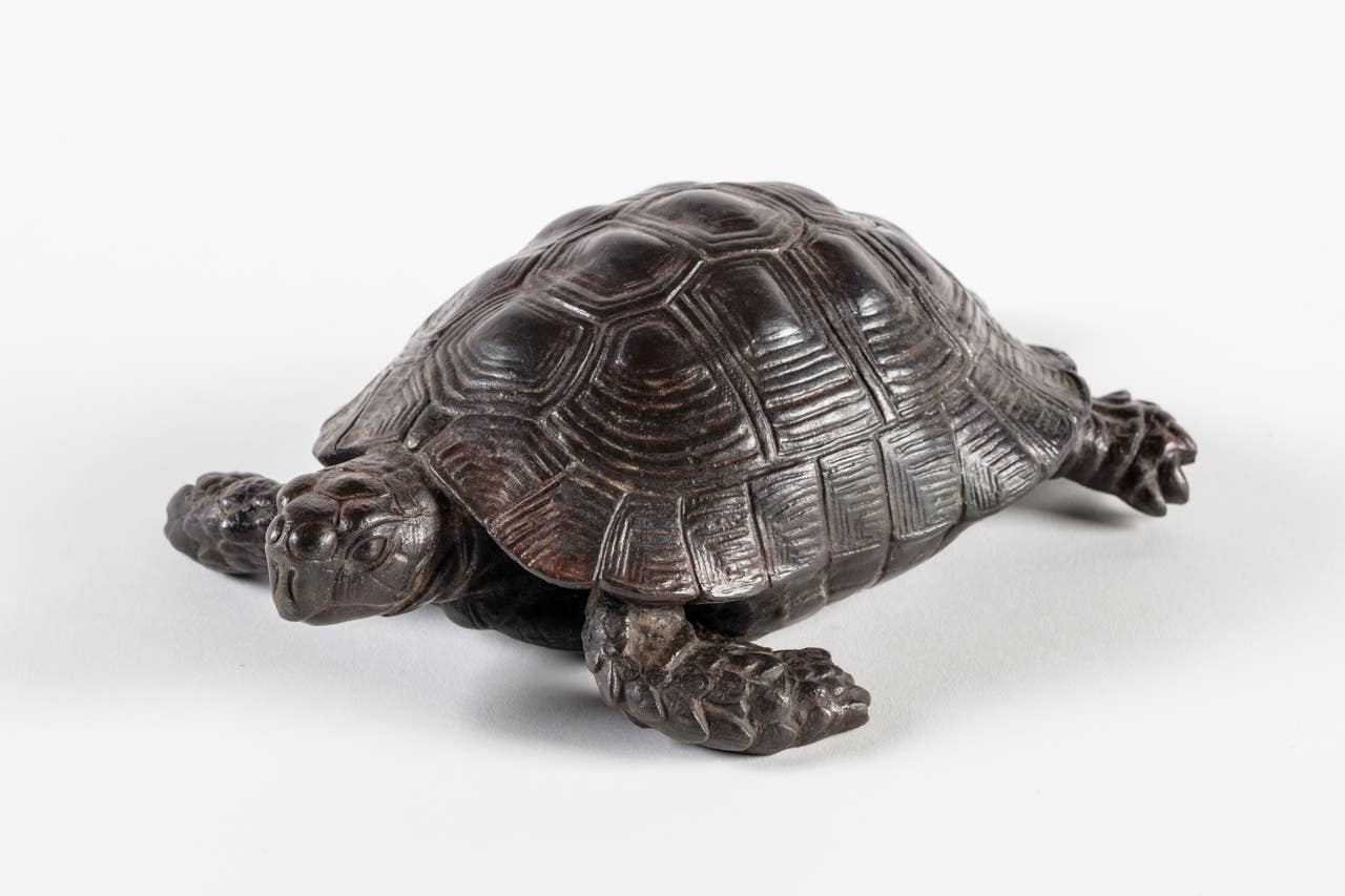 Slowly does it… bronze tortoises stolen 30 years ago return home