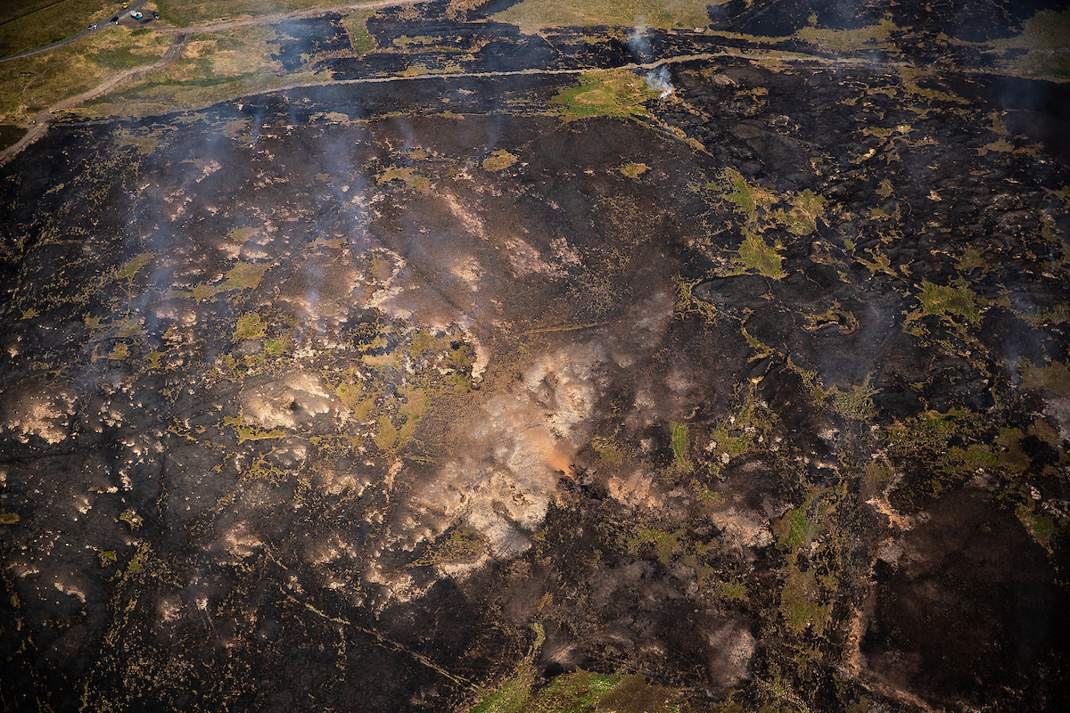 Land damaged by fires burning at Smithills (Joel Goodman/Woodland Trust/PA)