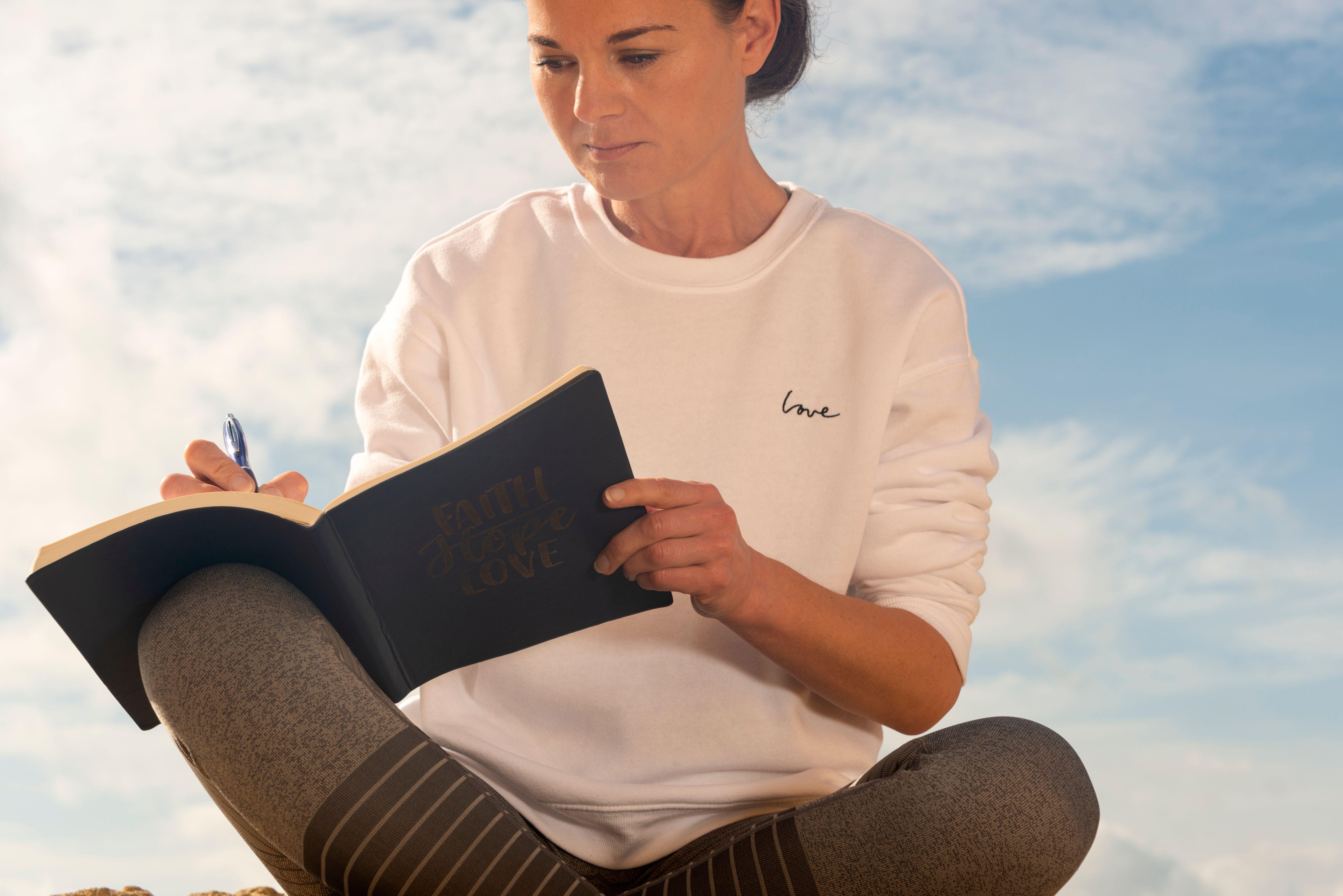 woman writing in her journal