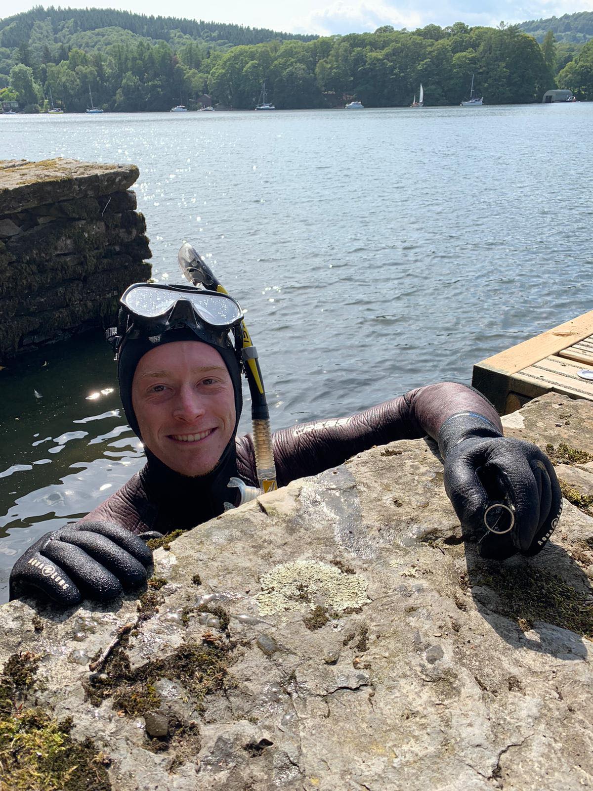 Lake District Diver Angus Hosking recovering the wedding ring of Annabelle and Mick Balchin after it was lost in Lake Windermere on their wedding day (Annabelle Balchin)