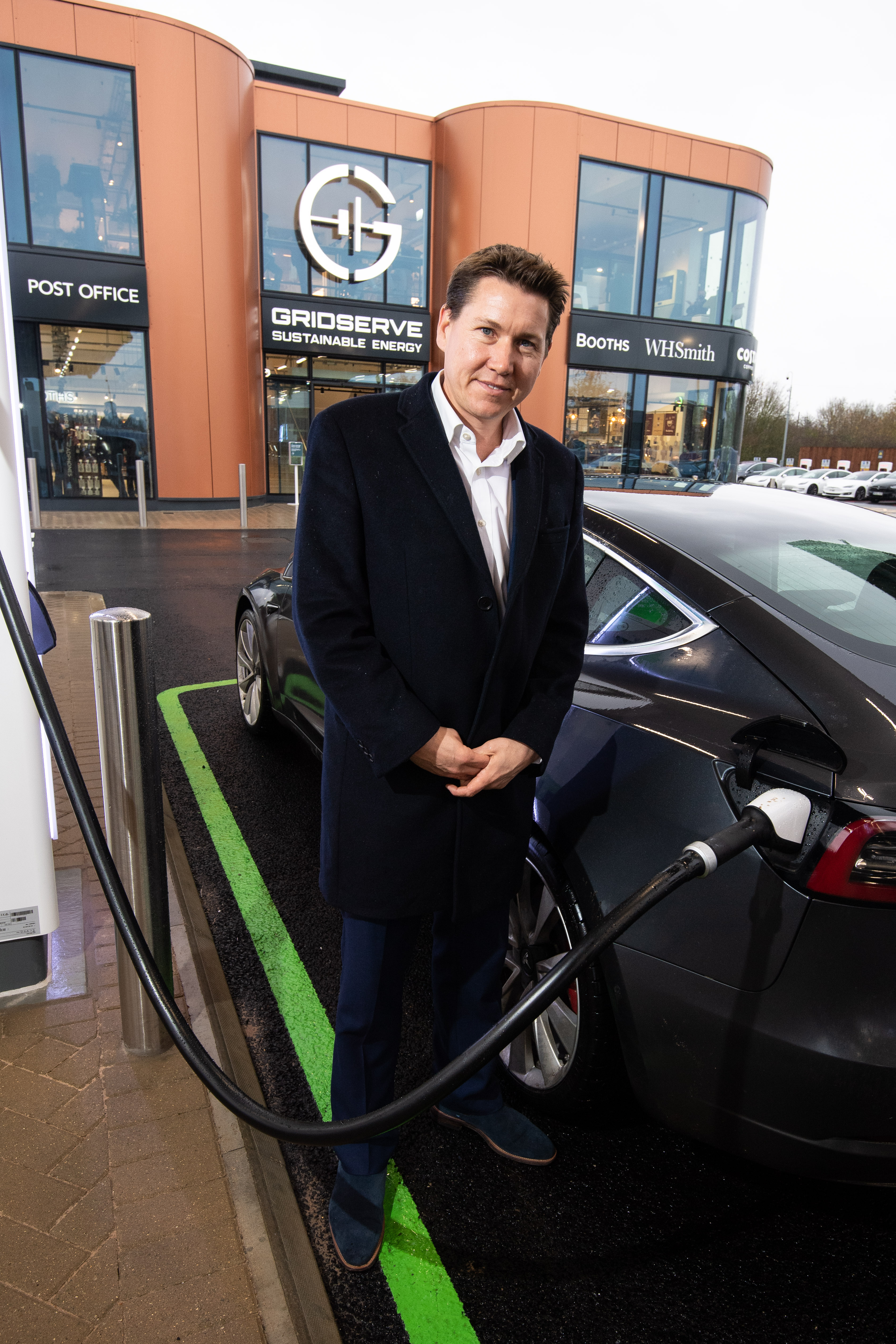 Toddington Harper charging a Tesla.