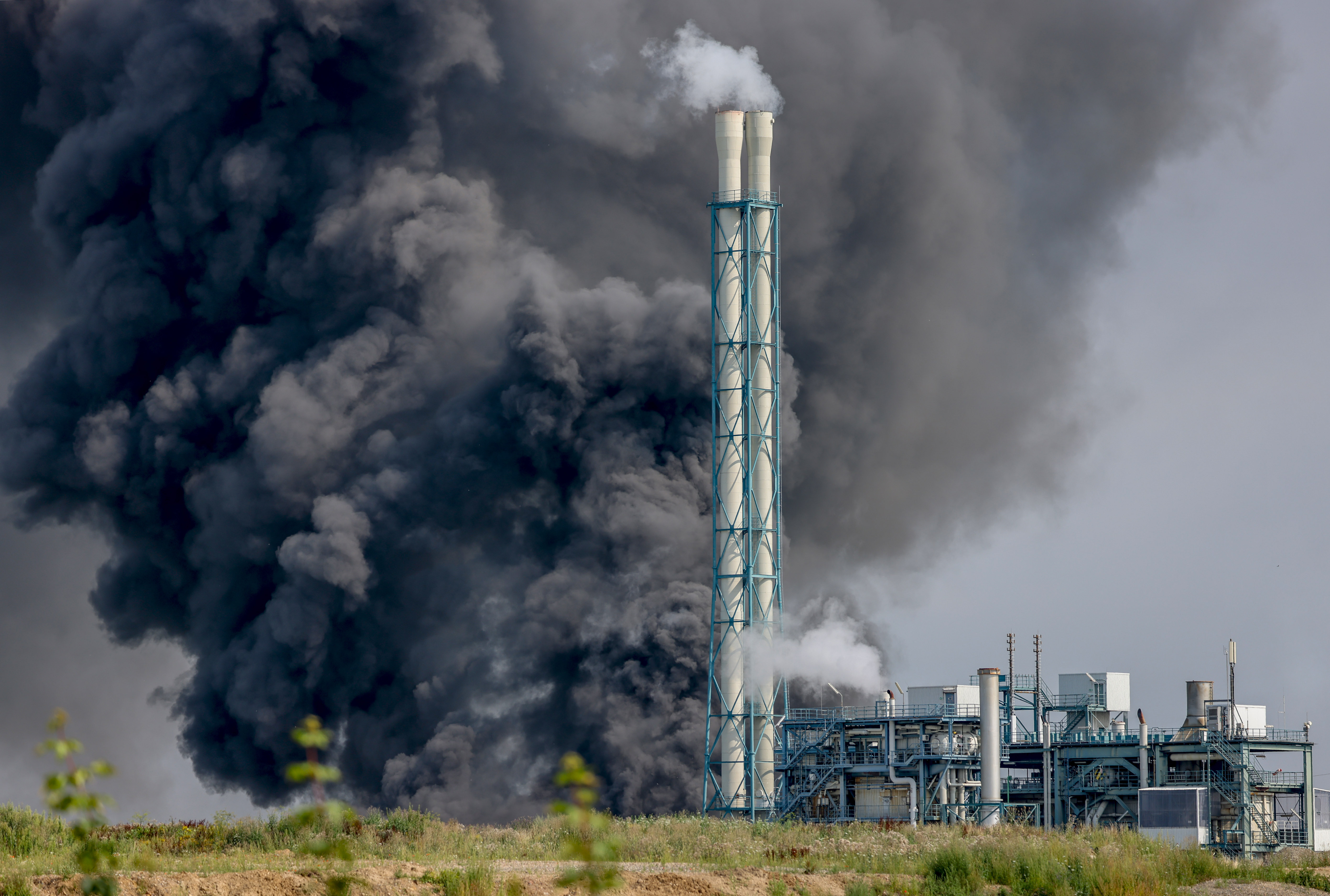 A dark cloud of smoke rises above the Chempark in Leverkusen 