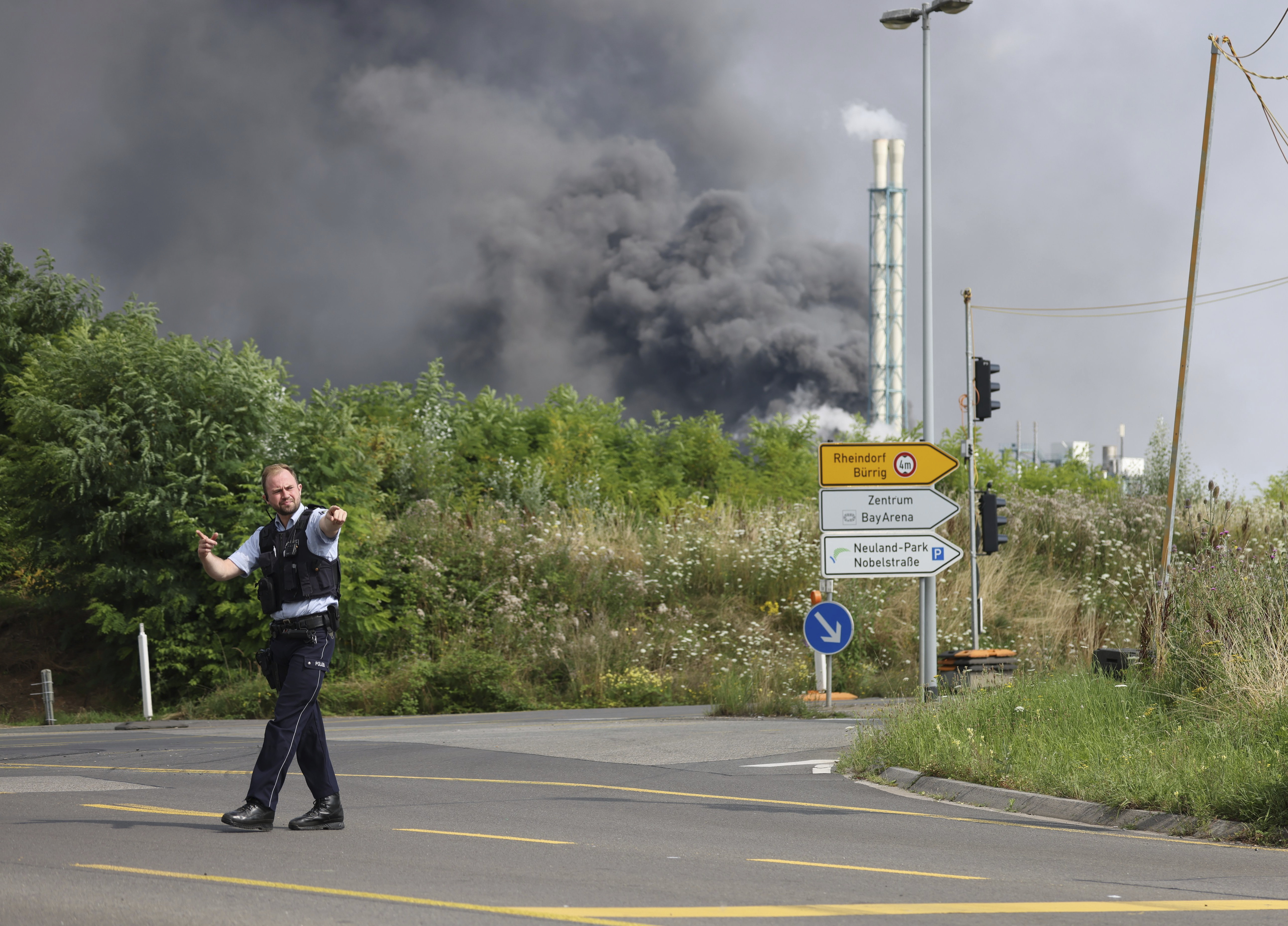 A police officer blocks an access road to the Chempark site 