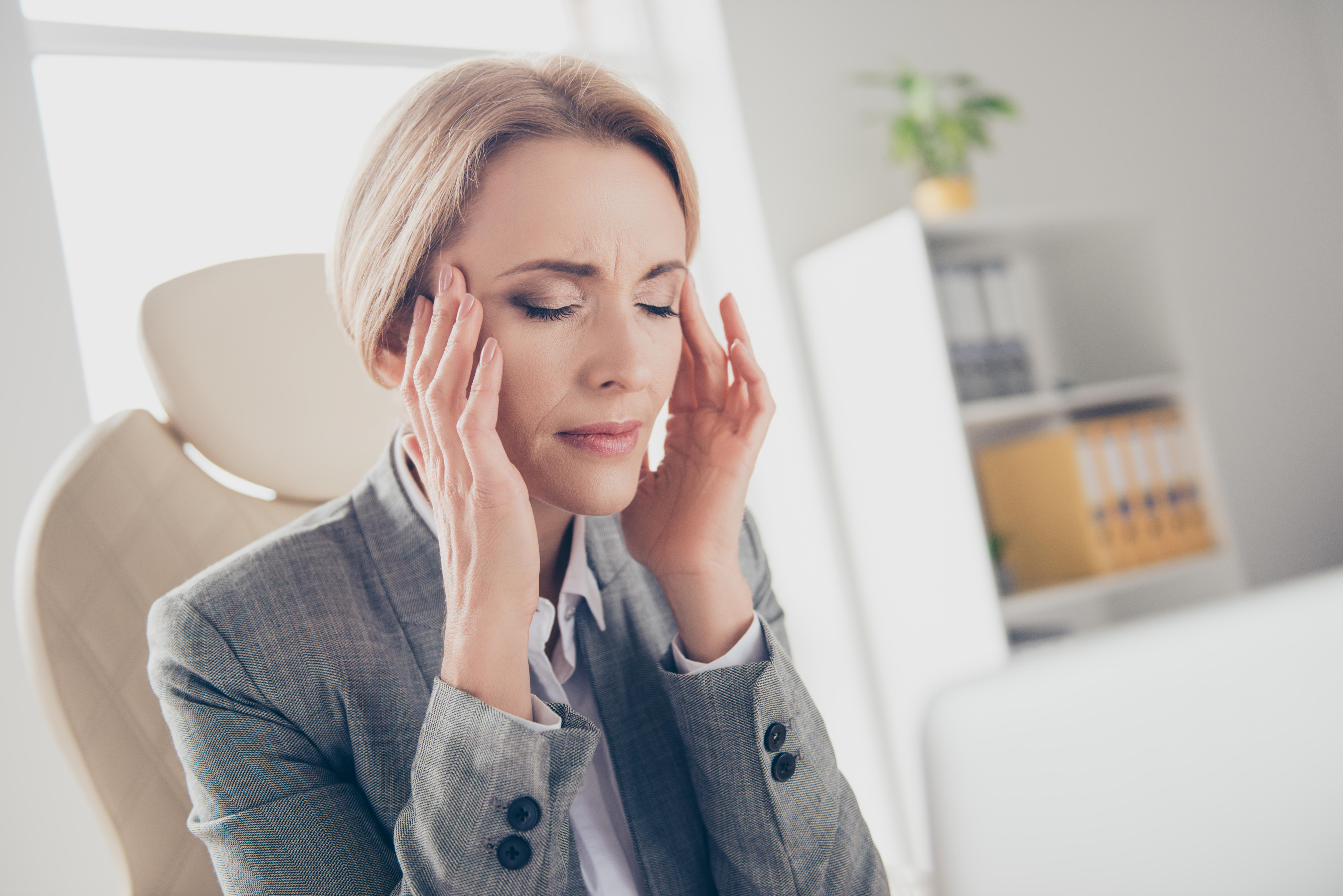 a woman with a headache (Alamy/PA)