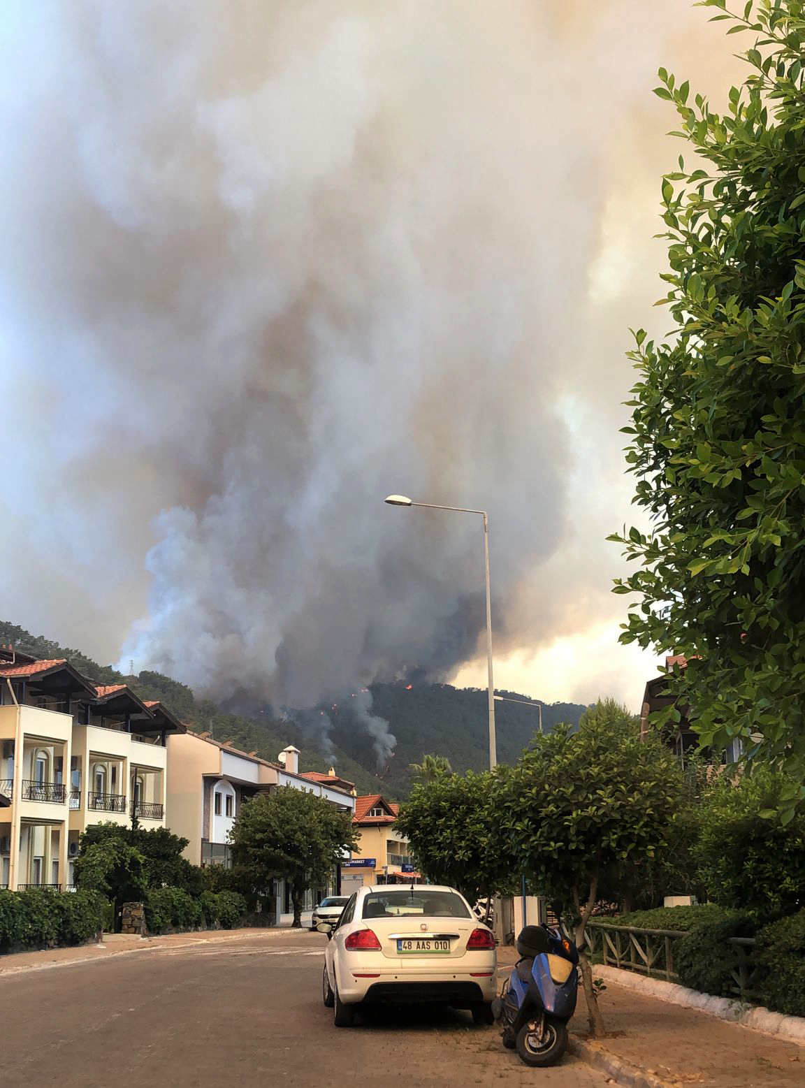 Smoke rises from a forest fire in the Icmeler area, near Marmaris, Turkey (Patrizia Under/AP)