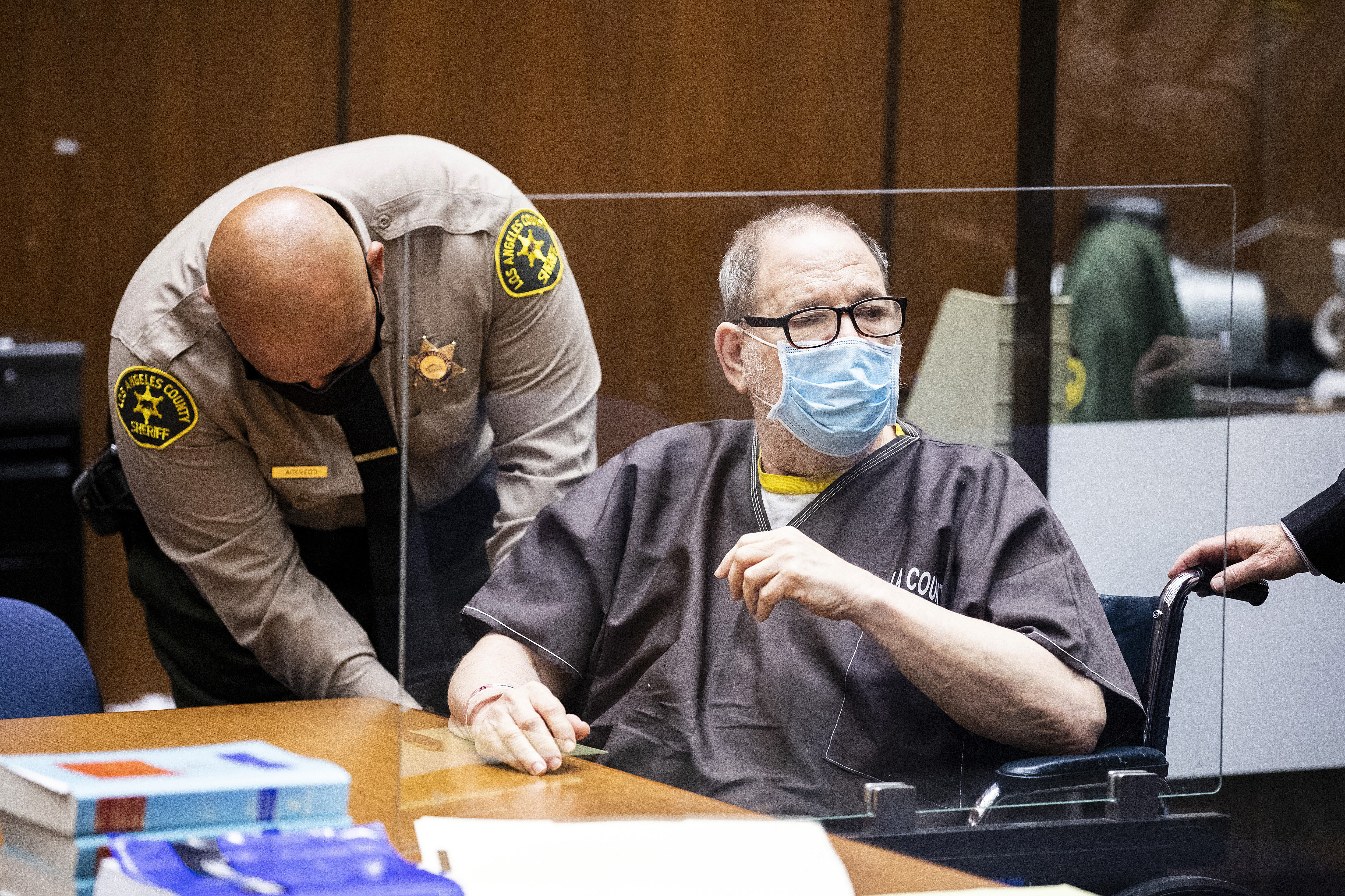 Harvey Weinstein behind a protective screen as he listens in court during a pre-trial hearing in Los Angeles