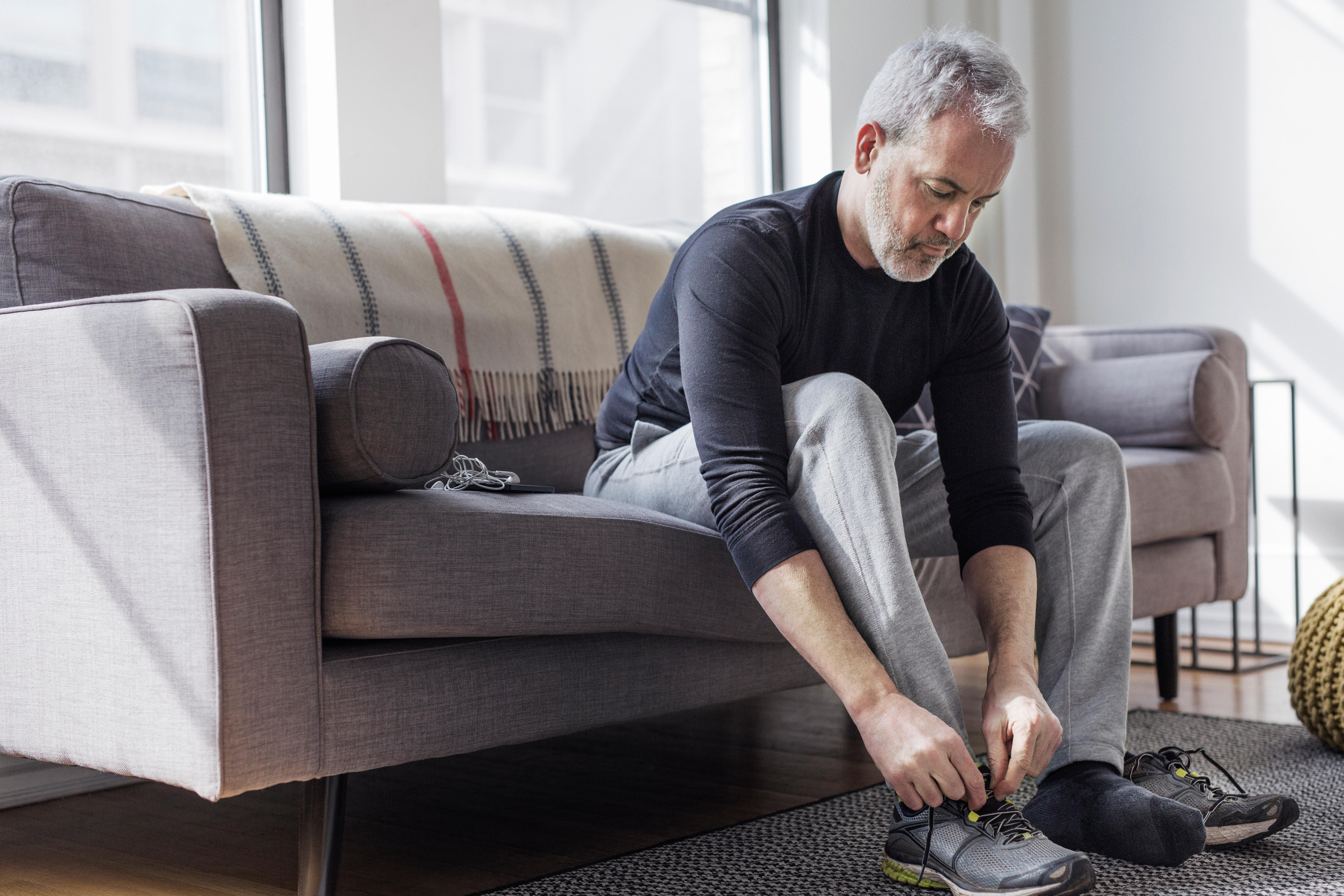 Man putting trainers on