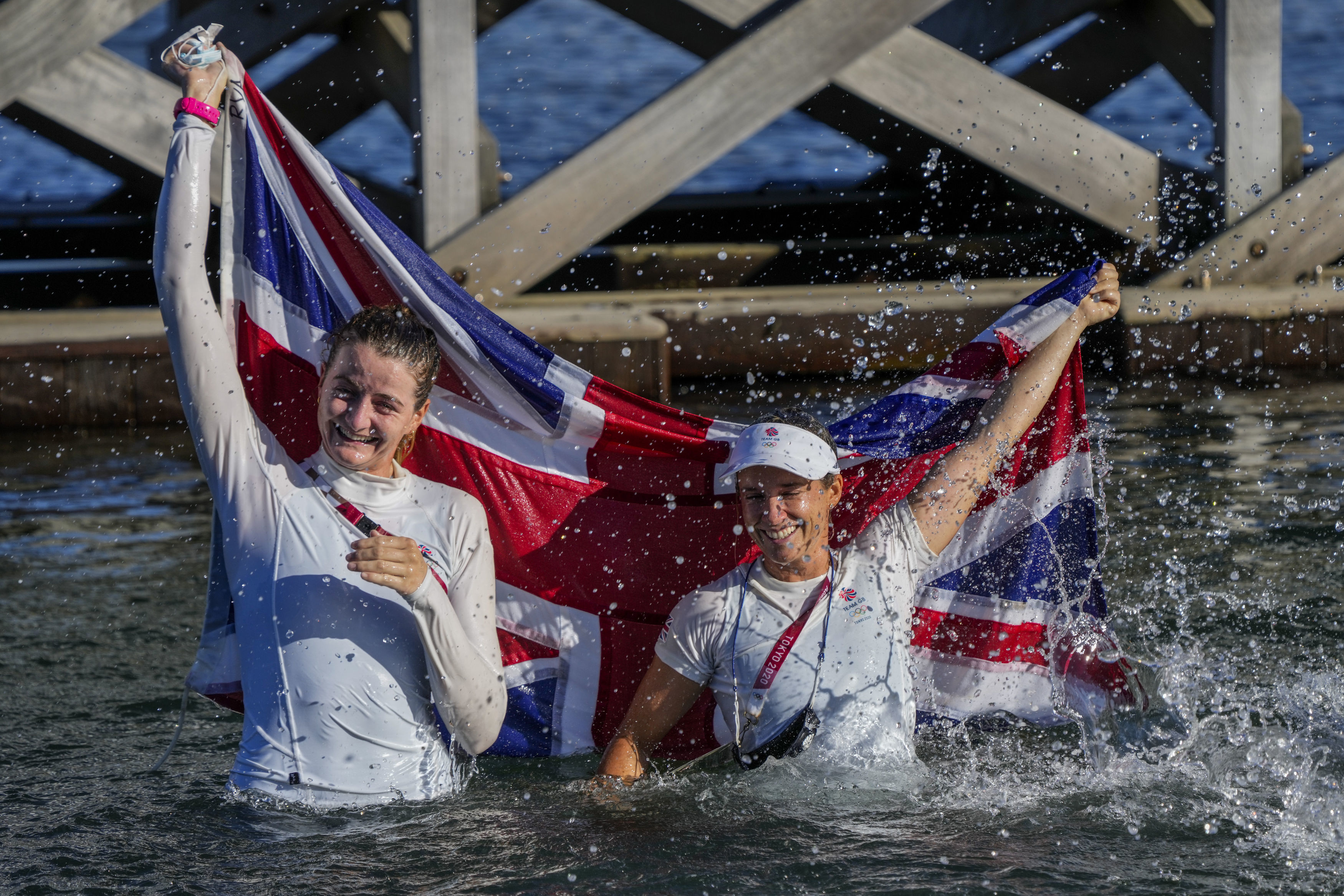 Great Britain's Hannah Mills, right, and Eilidh Mcintyre celebrate after winning the 470 women's gold medal 