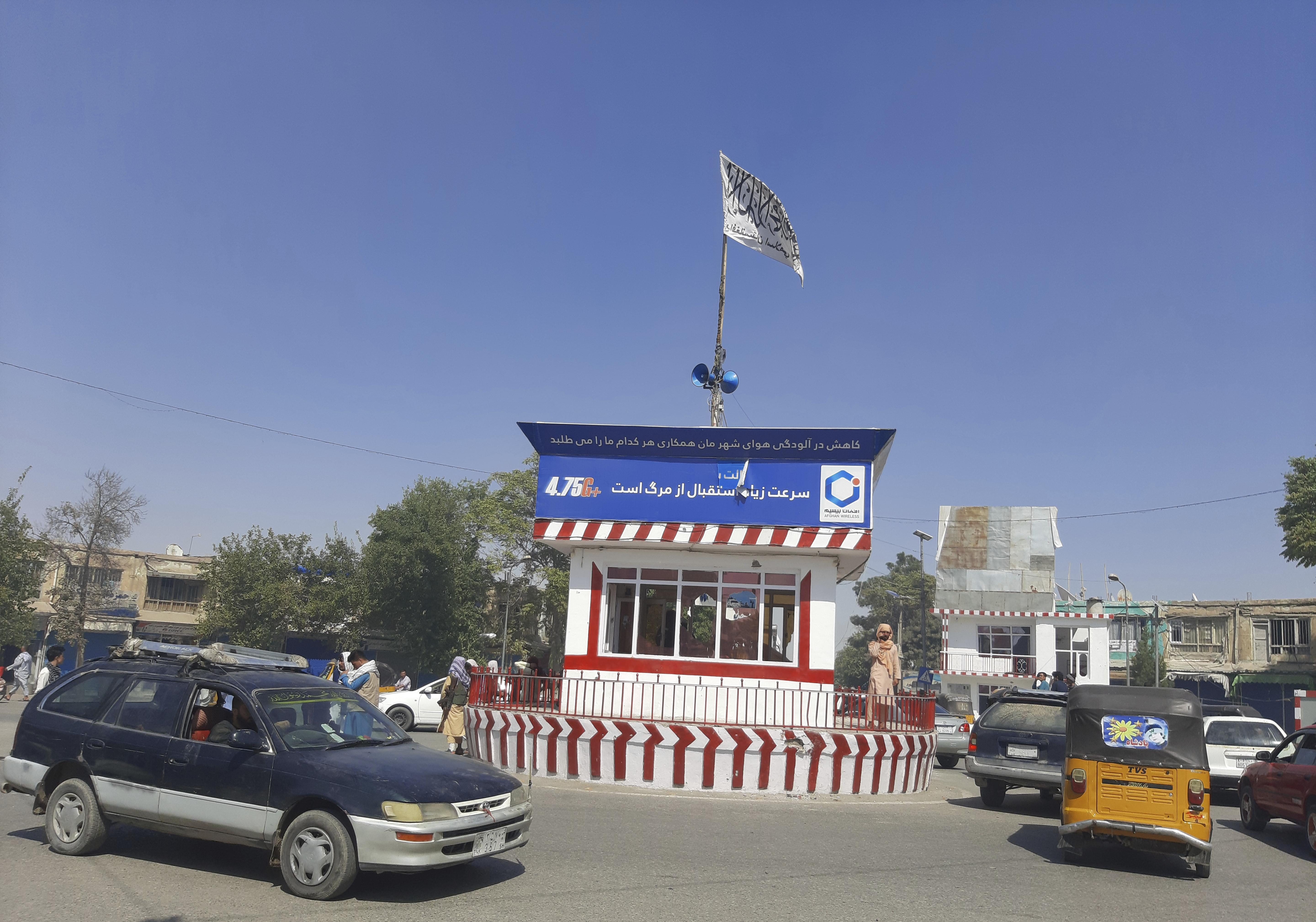 A Taliban flag flies in the main square of Kunduz city after fighting between Taliban and Afghan security forces, in Kunduz, Afghanistan