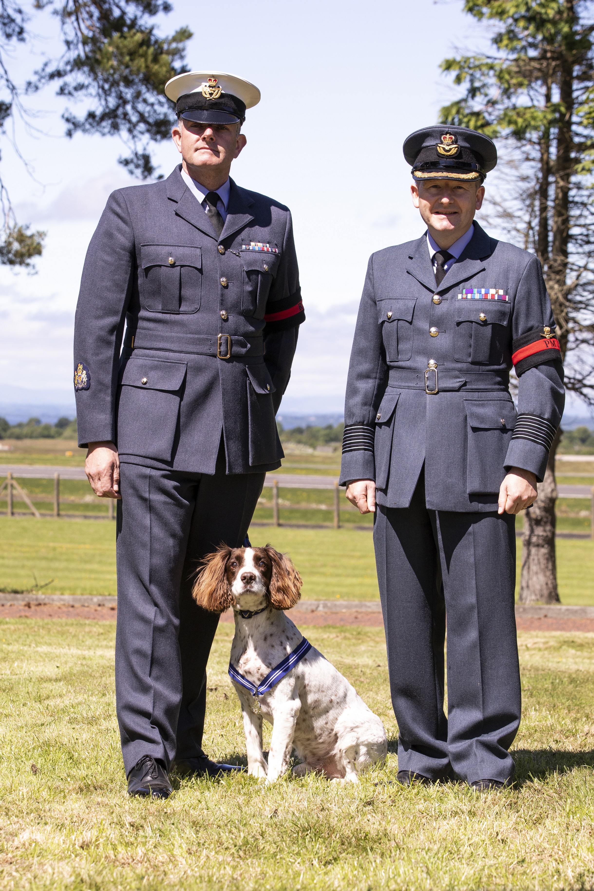 Provost Marshal Warrant Officer Lee Close; PDSA Order of Merit recepient Alfie; Provost Marshal Group Captain David Wilkinson