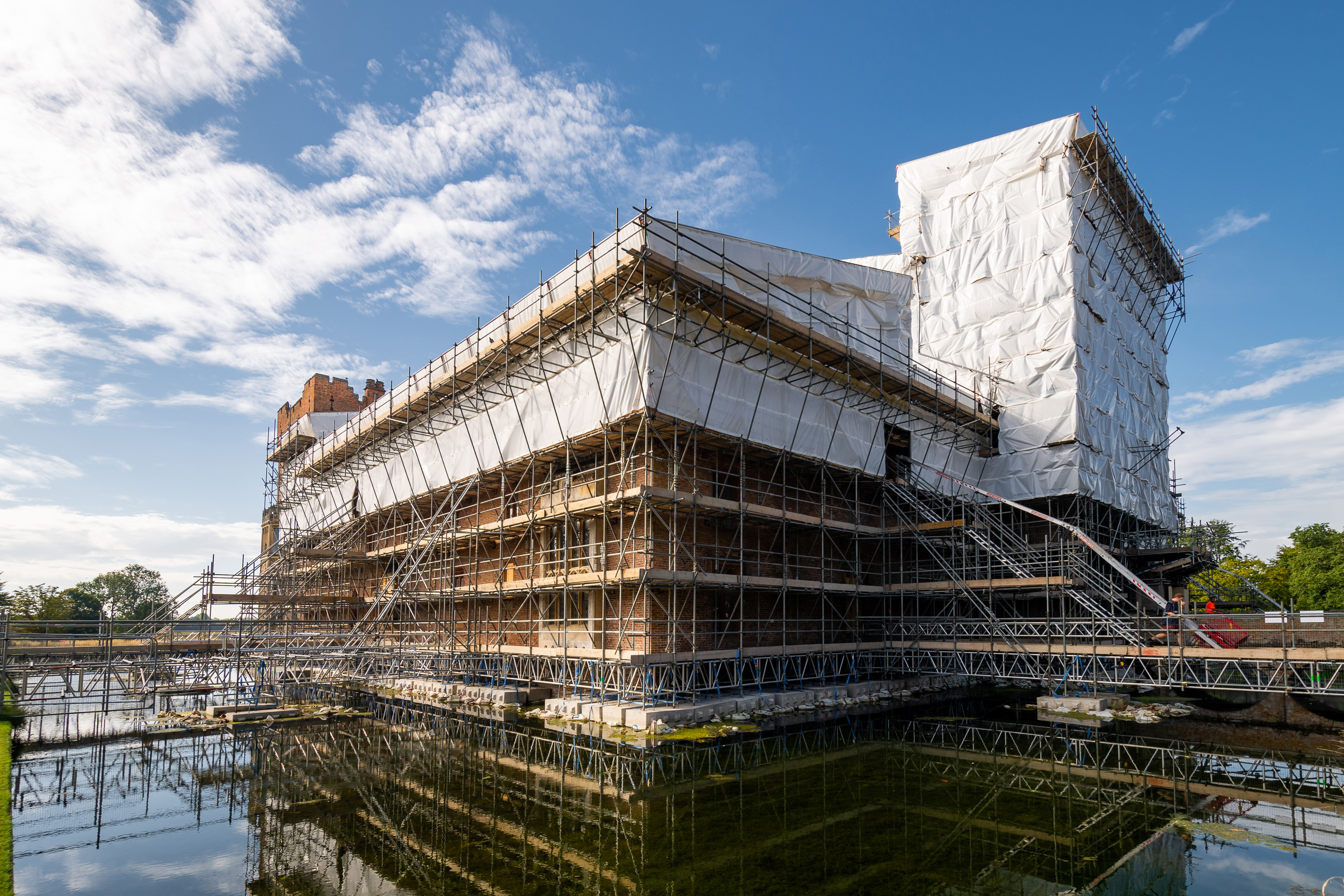 Oxburgh Hall in Norfolk is nearing the end of a £6 million re-roofing project, which includes non-slip tiles for bats. (National Trust/ Nicholas Farka/ PA)