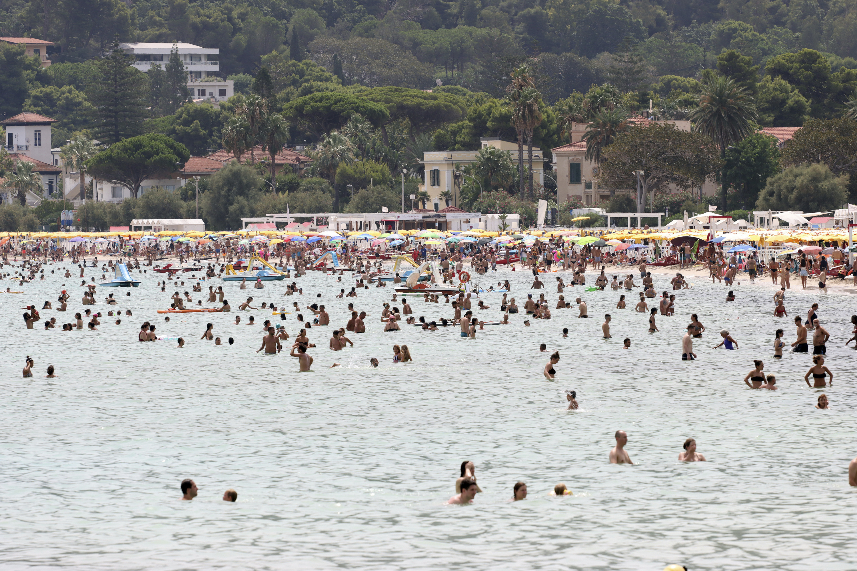 People refresh in the sea in Palermo, Sicily, Italy 