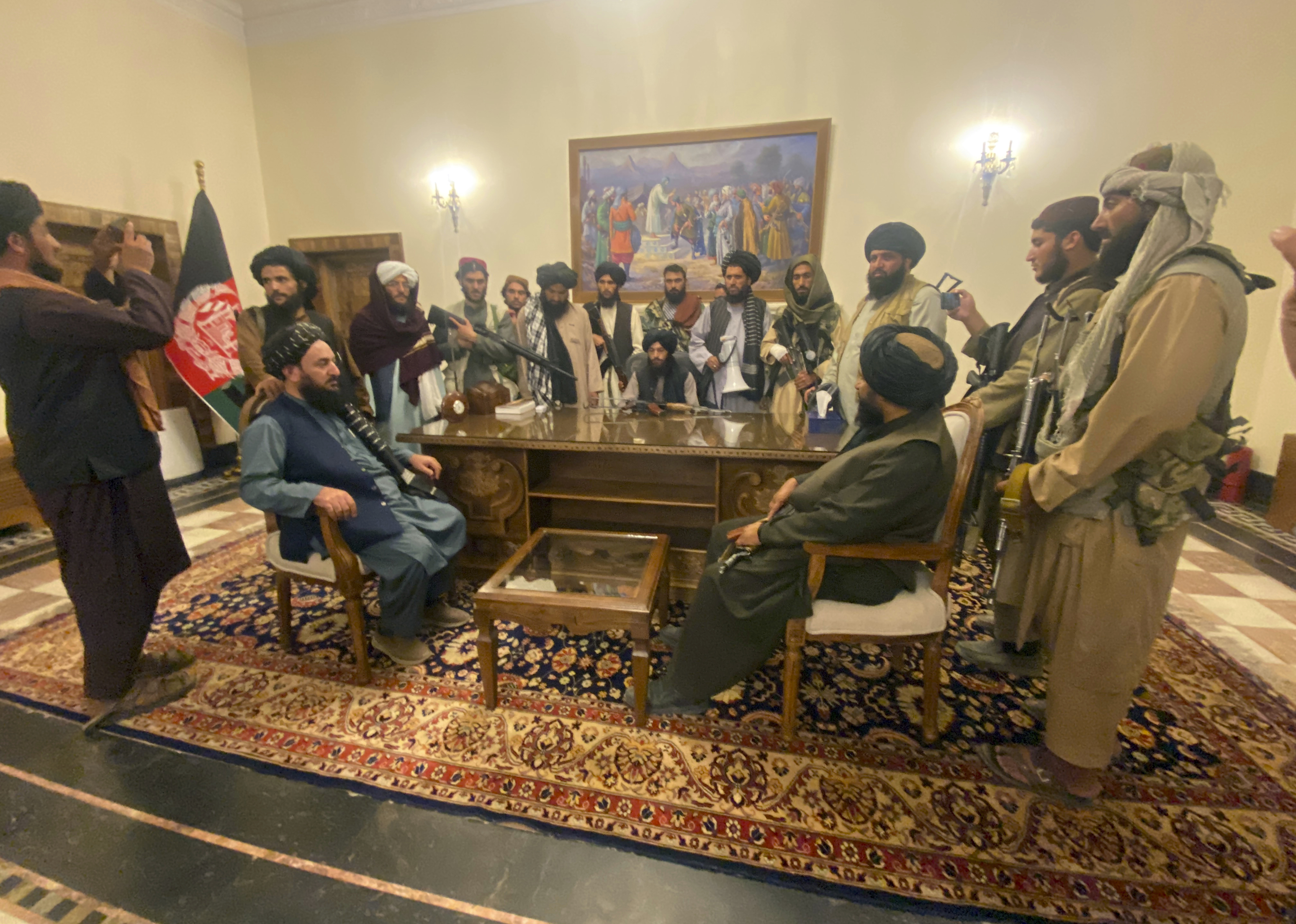 Taliban fighters take control of the Afghan presidential palace in Kabul after President Ashraf Ghani fled the country