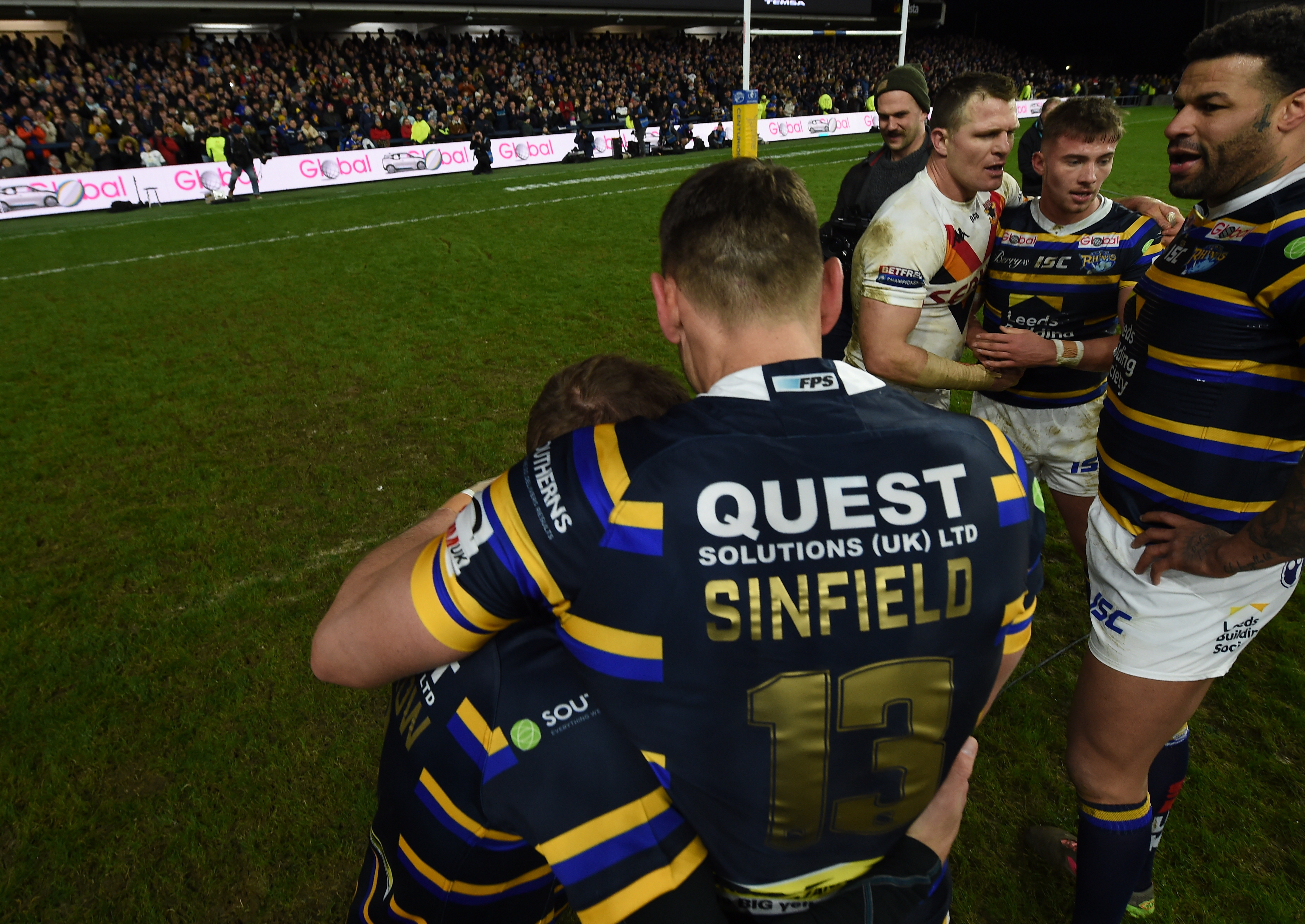 The image from the fundraising game between Leeds and Bradford in January 2020 that the statue is based on