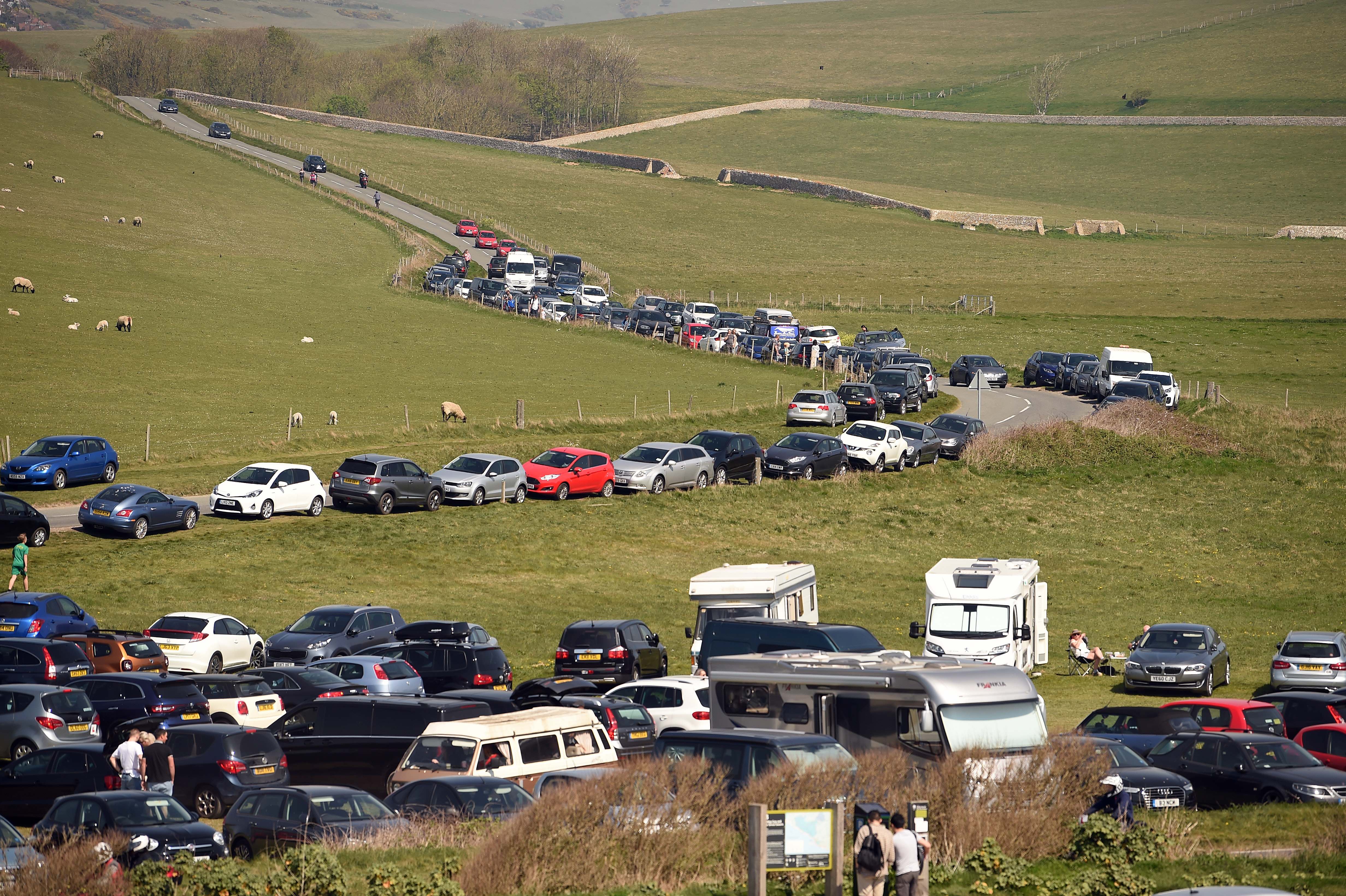Busy car park on the cliff top during the Cadbury Easter Egg Hunt at Birling Gap and the Seven Sisters, East Sussex