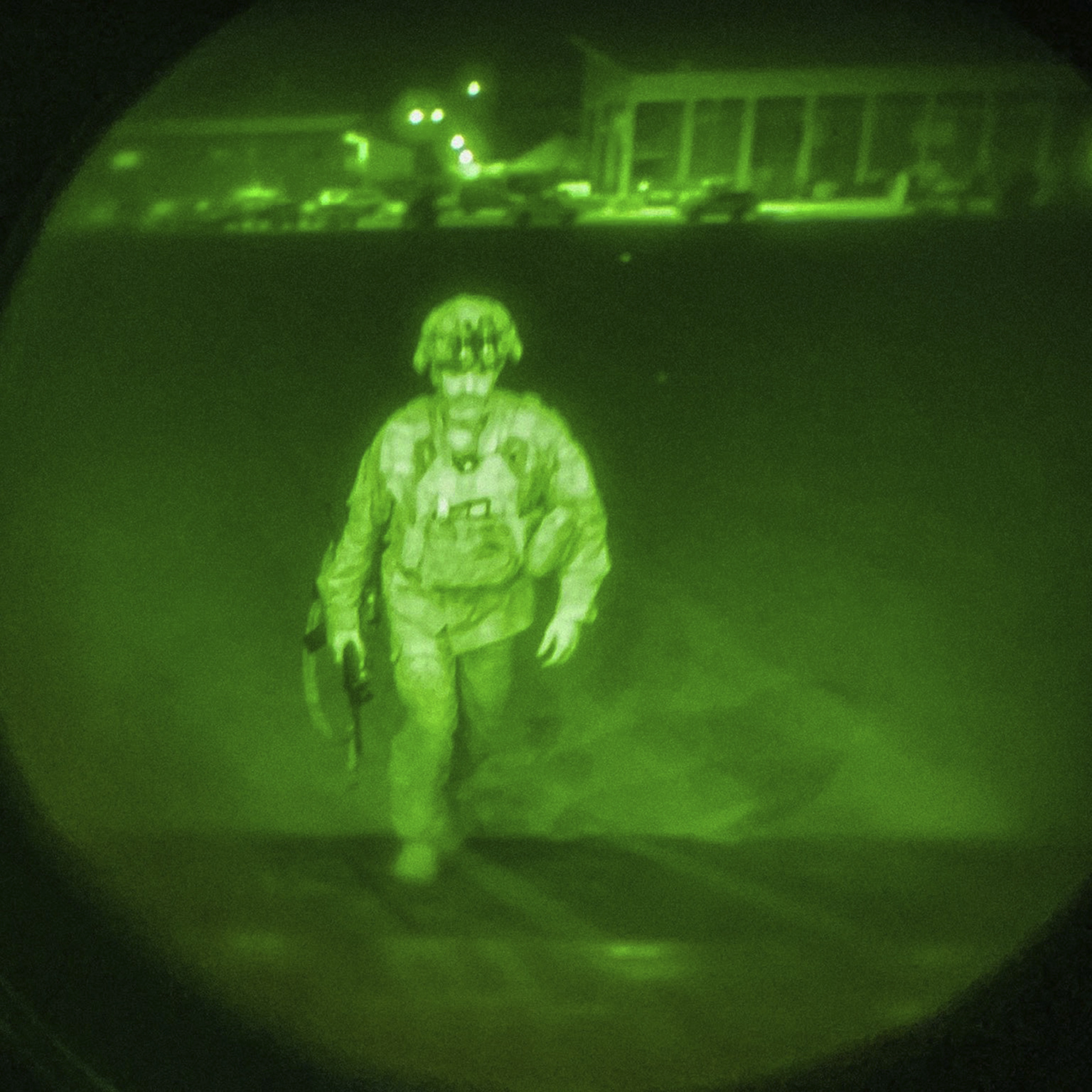 A night vision picture of Major General Chris Donahue, commander of the US Army 82nd Airborne Division, XVIII Airborne Corps, boards a C-17 cargo plane at Hamid Karzai International Airport in Kabul as the final American service member to depart Afghanistan (US Central Command via AP)