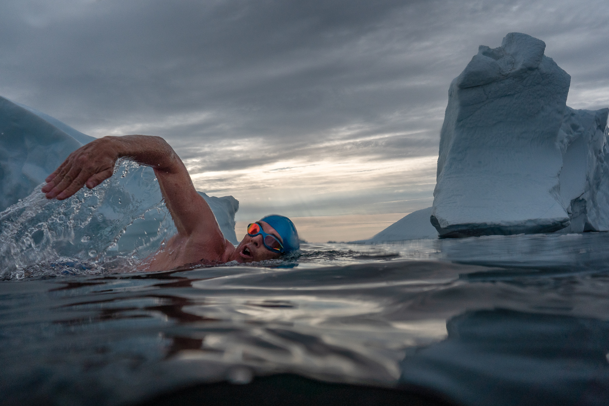 Lewis Pugh swimming among icebergs