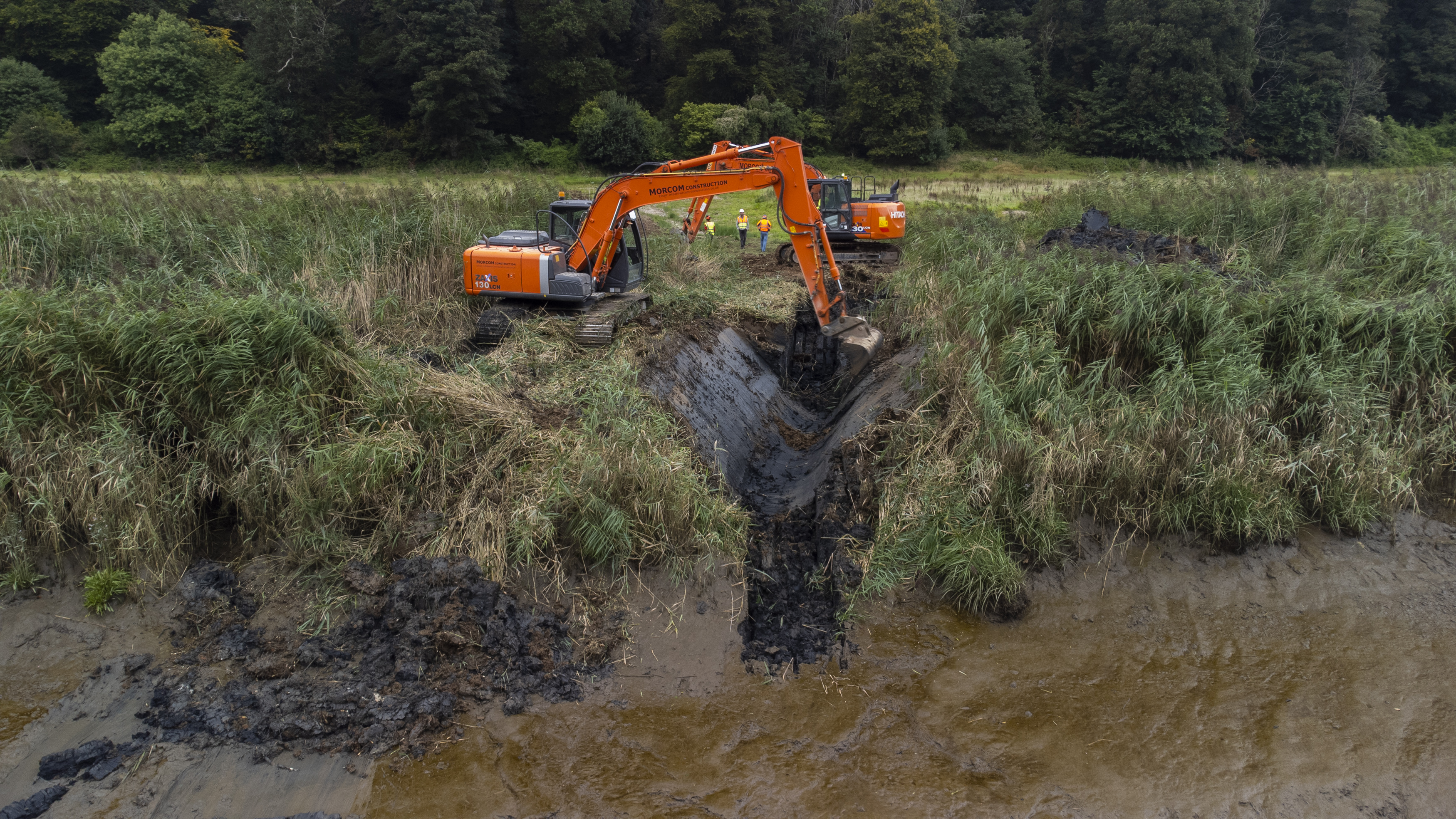 Cranes were used to create the breach in the riverbank (Steve Haywood/National Trust/PA)