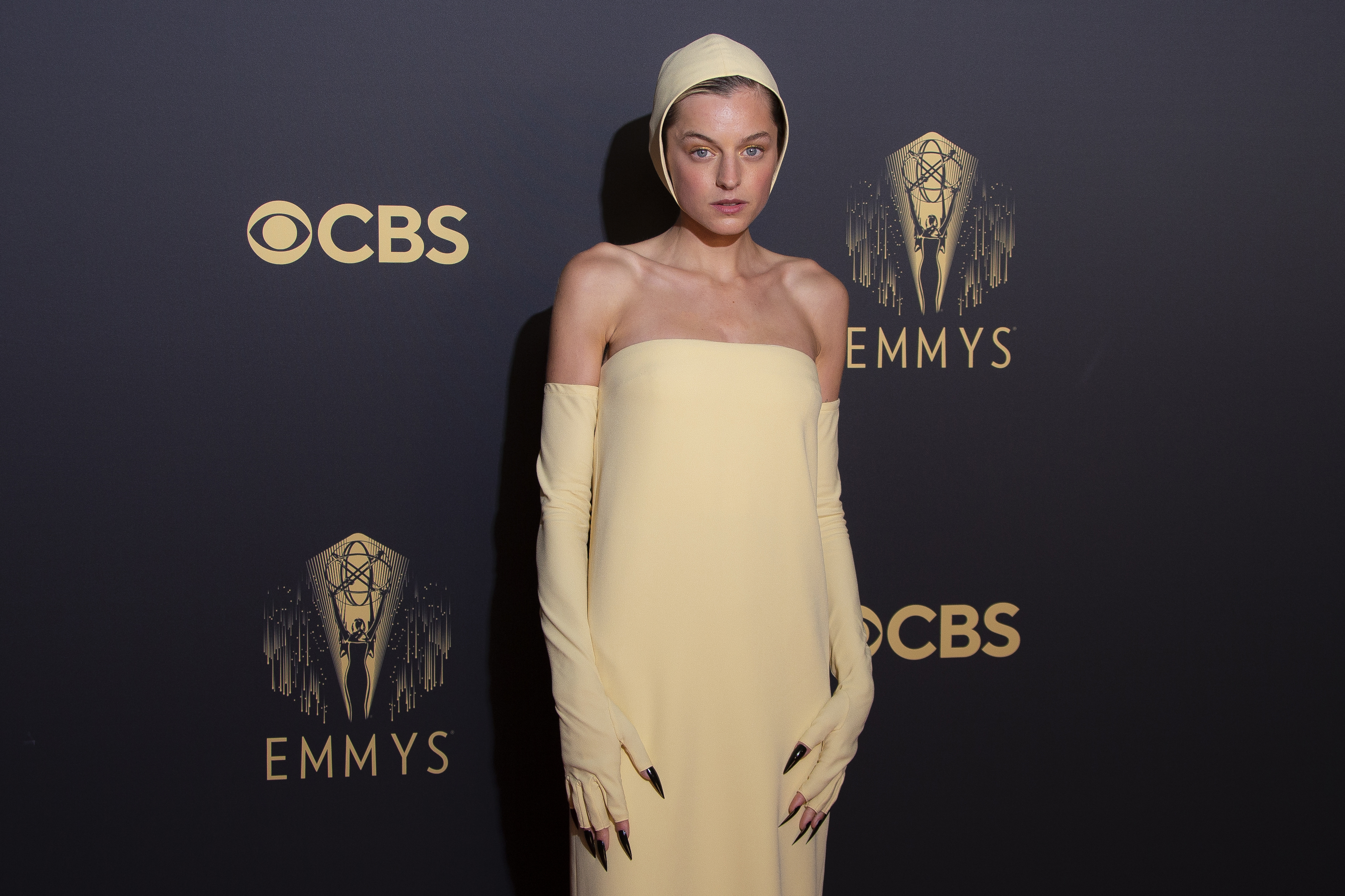 Emma Corrin poses for photographers as she arrives for the Netflix Celebration of the 73rd Primetime Emmy Awards in central London