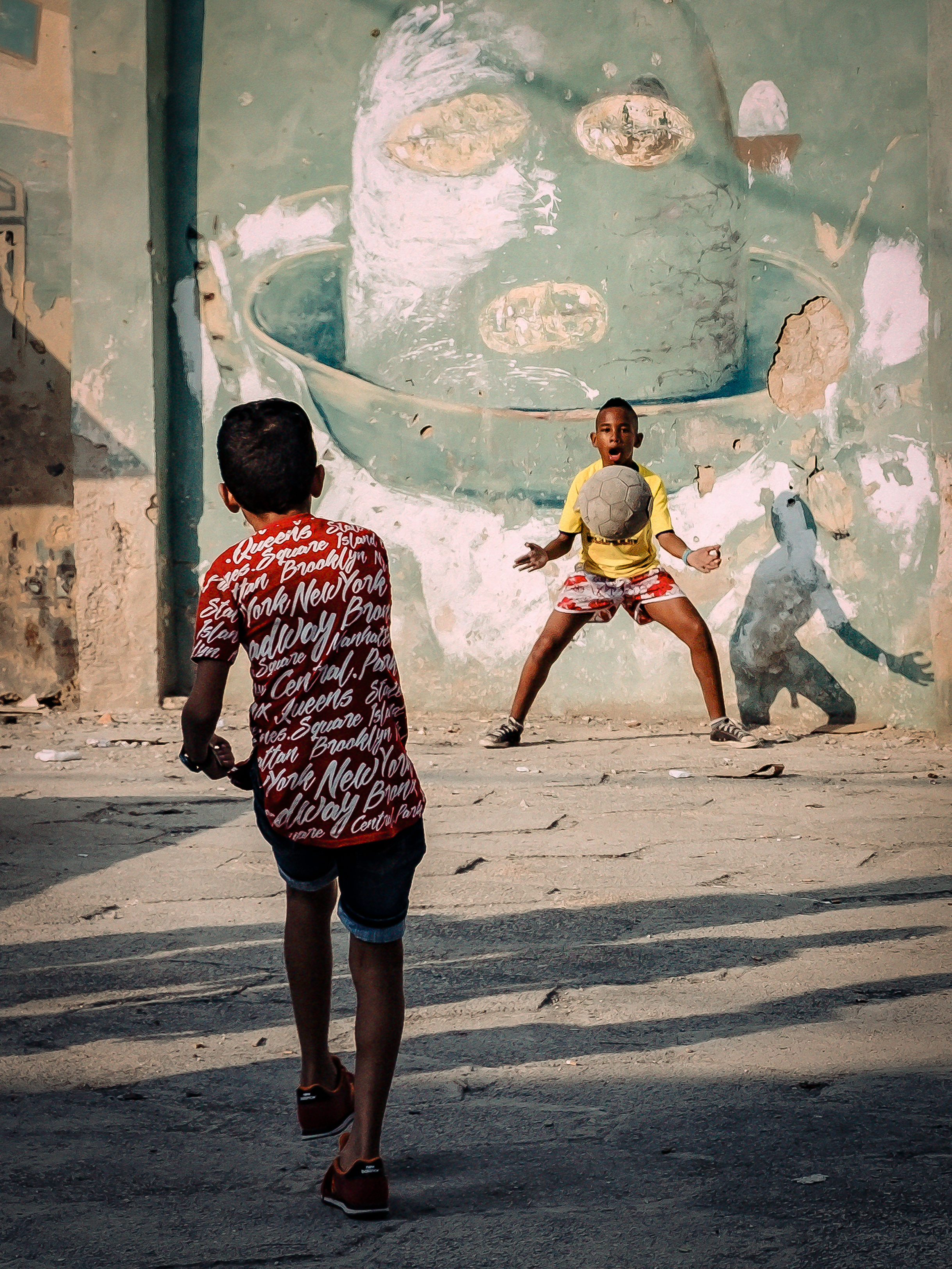Children play football in the street in Havana in this photograph by Andreas Bauer