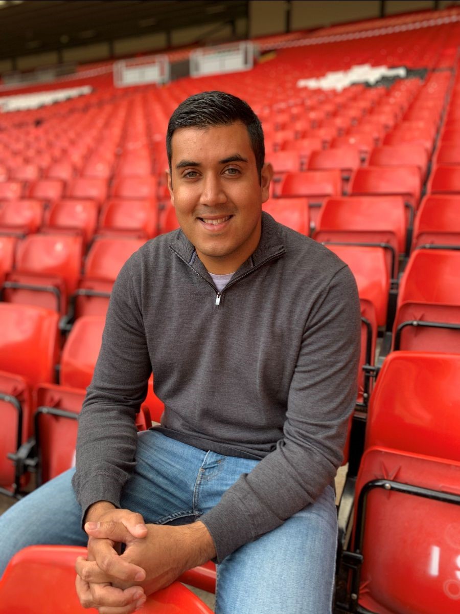Liverpool's senior manager equality, diversity and inclusion Rishi Jain sat in the stand at Anfield