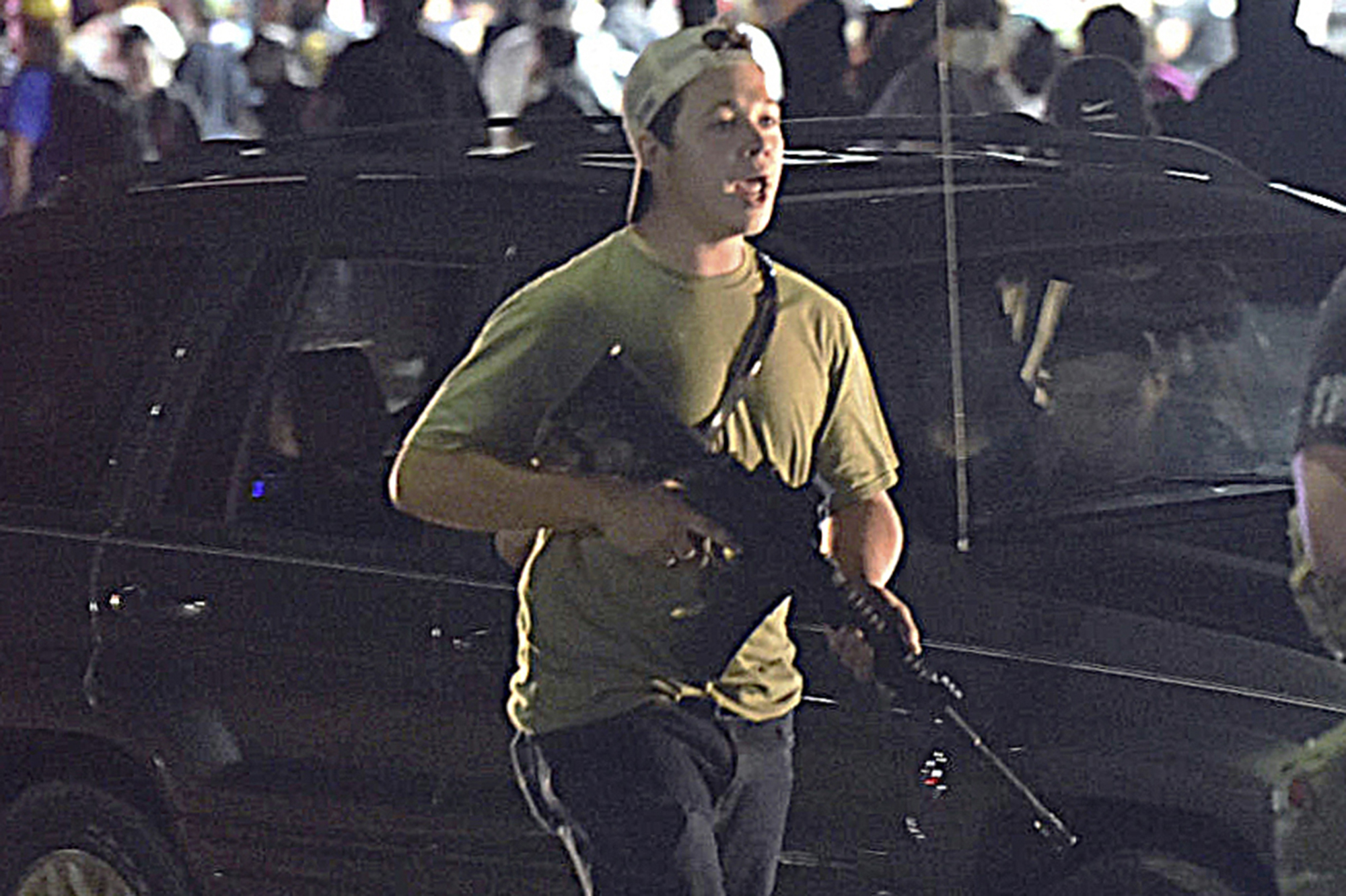 Kyle Rittenhouse carries a weapon in Kenosha, Wisconsin, on August 25 2020 during a night of unrest following the police shooting of Jacob Blake