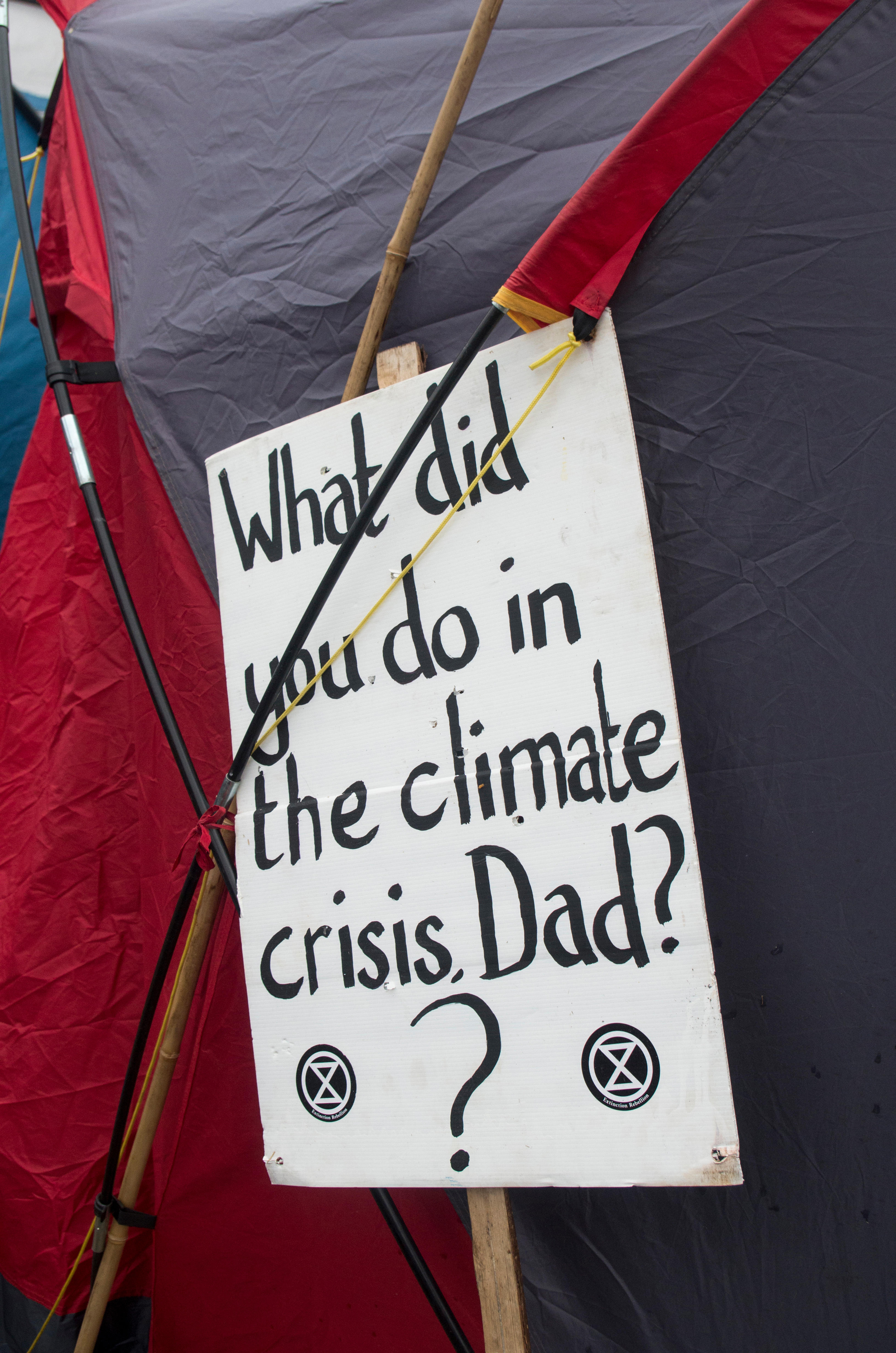 A banner that says 'what did you do in the climate crisis, dad?