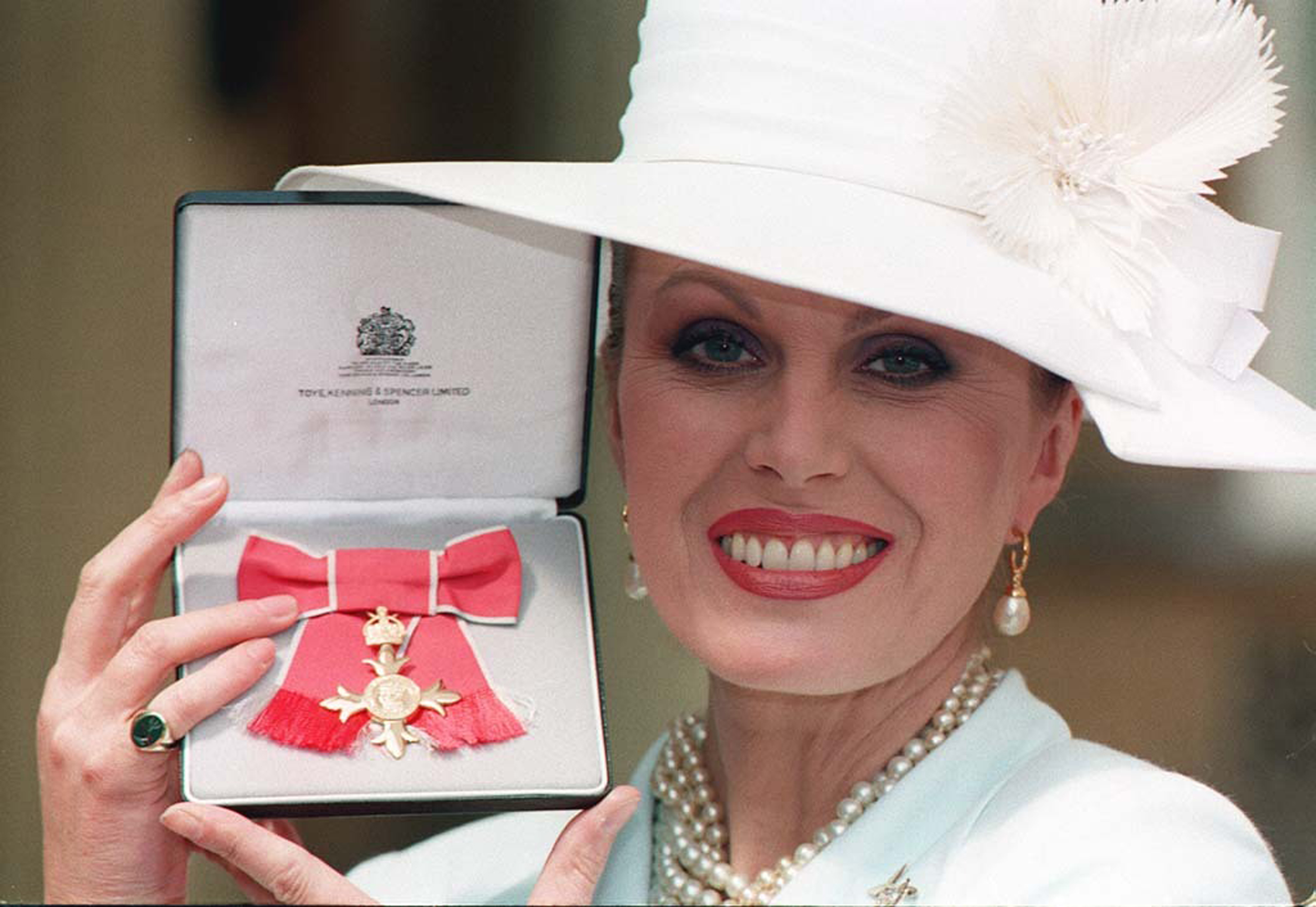 Joanna Lumley receiving her OBE in 1995 (John Stillwell/PA)