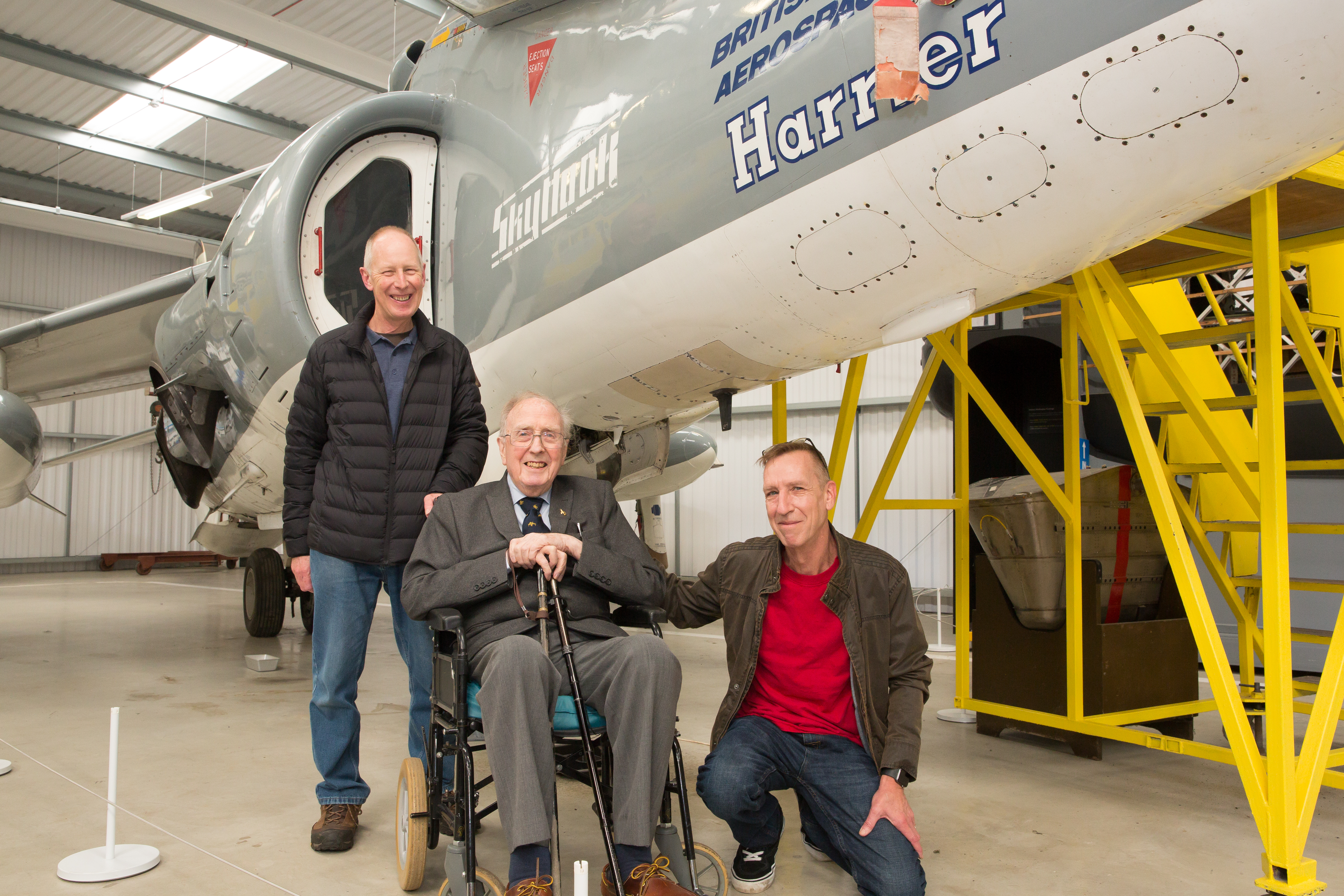 Roy Whitehead with his sons Jon and Rob next to the Harrier jet