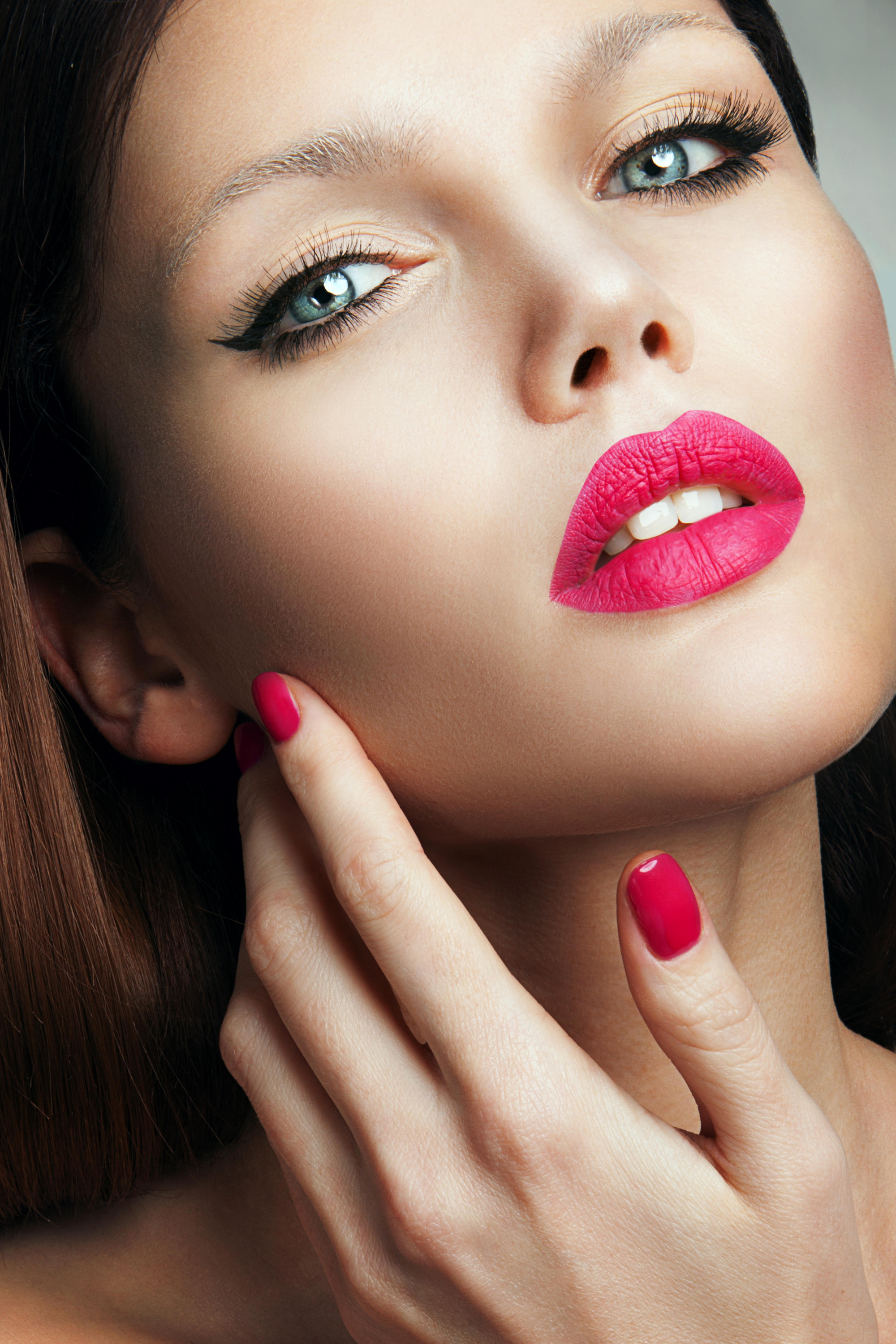 Woman with matte pink lipstick