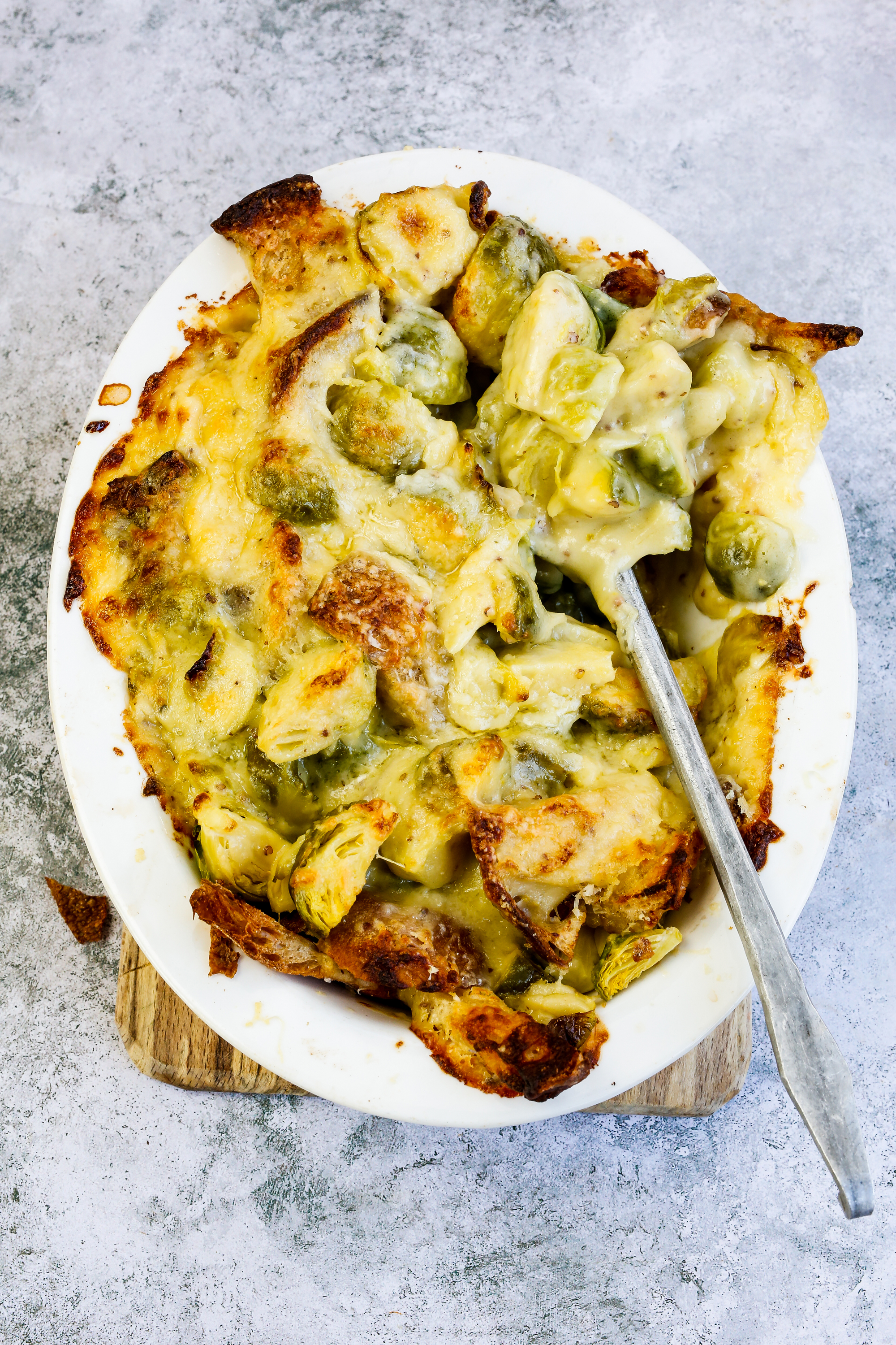 Savoury Bread Pudding with Cheesy Sprouts from The Complete Vegetable Cookbook: A Seasonal, Zero-waste Guide to Cooking with Vegetables by James Strawbridge (DK/PA)
