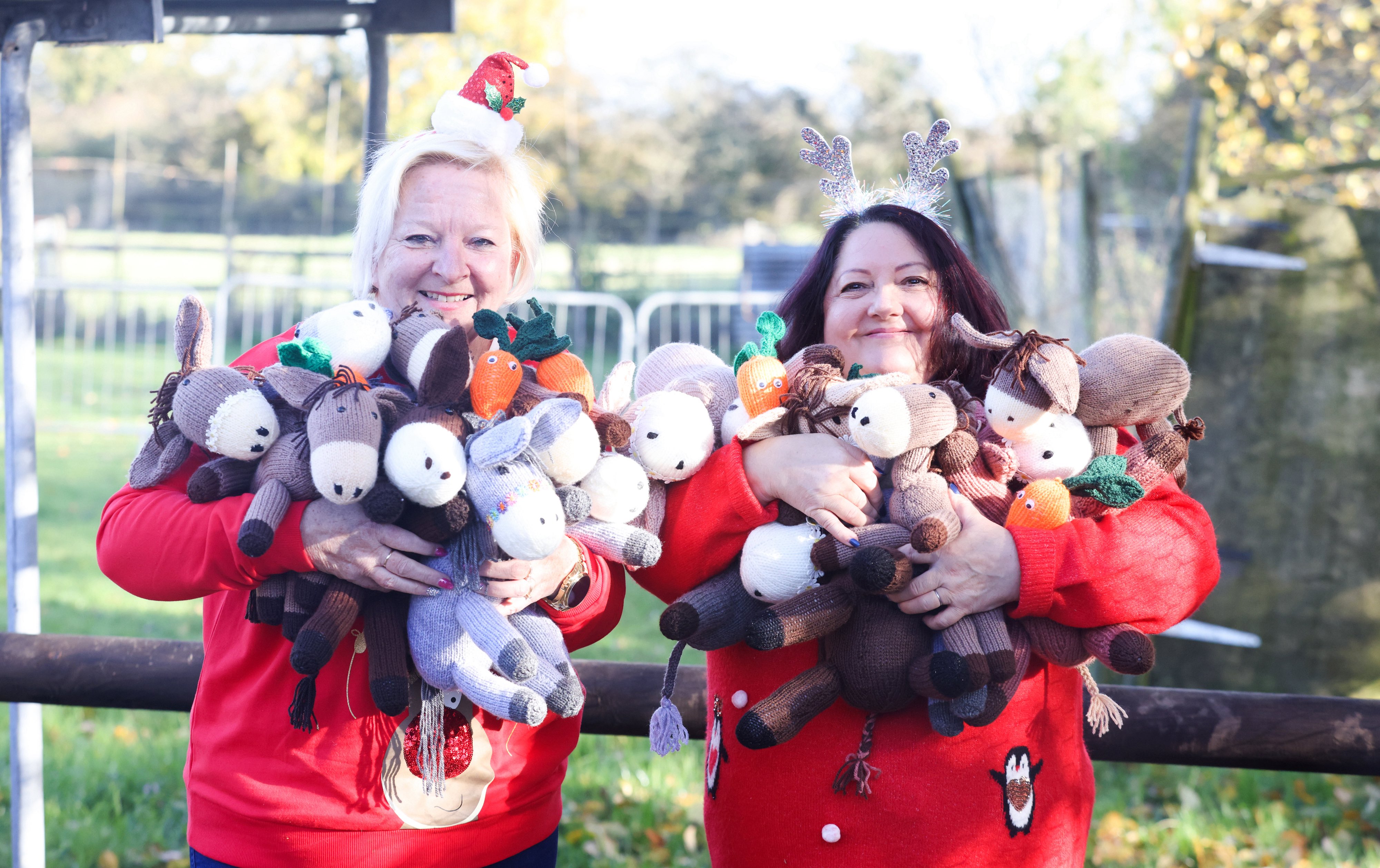 Lottery winners Debra Pearce (right) and Susan Crossland with some of the knitted toys. (National Lottery/ PA)