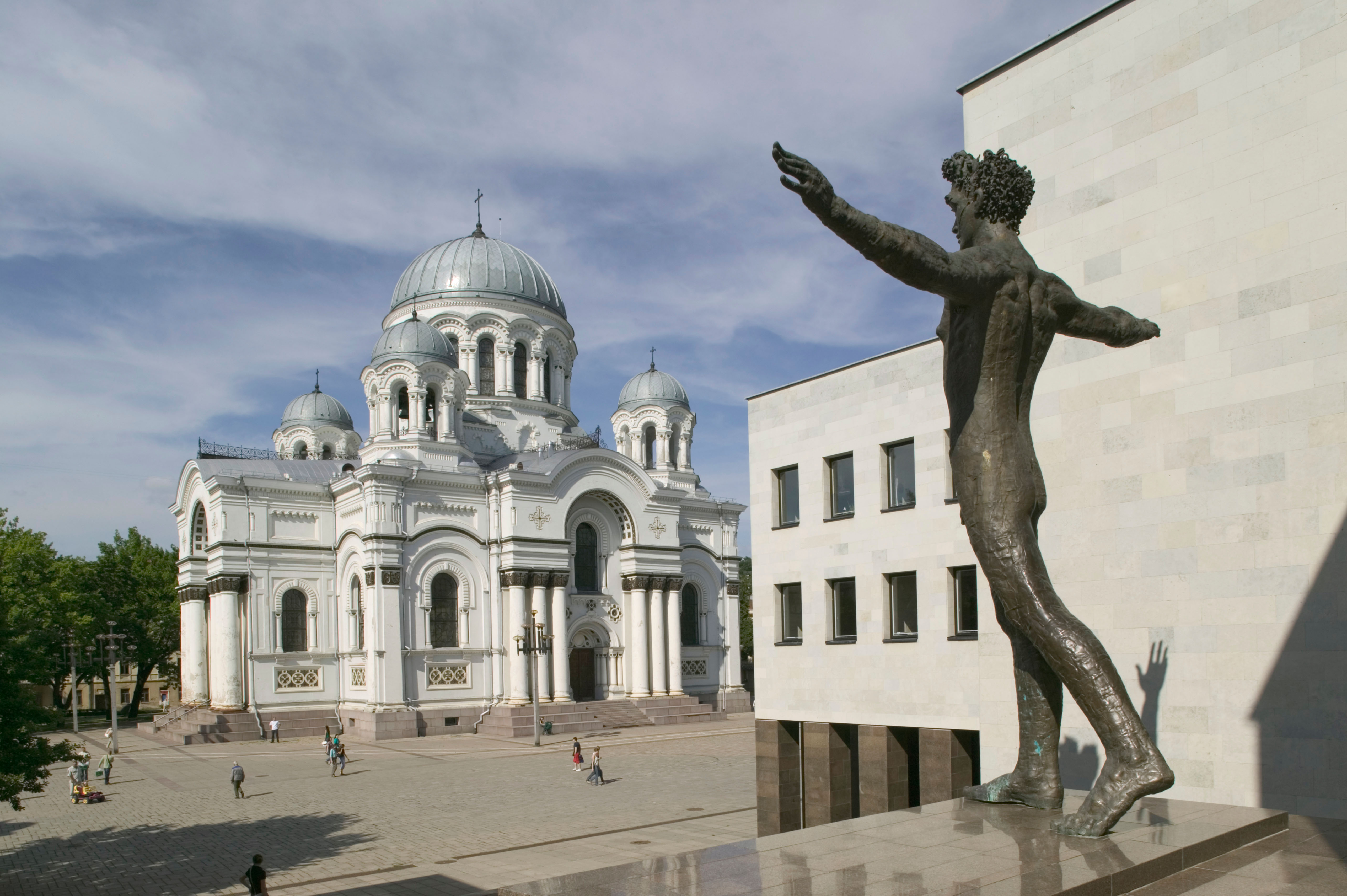 Lithuania, Kaunas, St Michael's Church seen from the Zilinskas Art Gallery and the nude boy statue