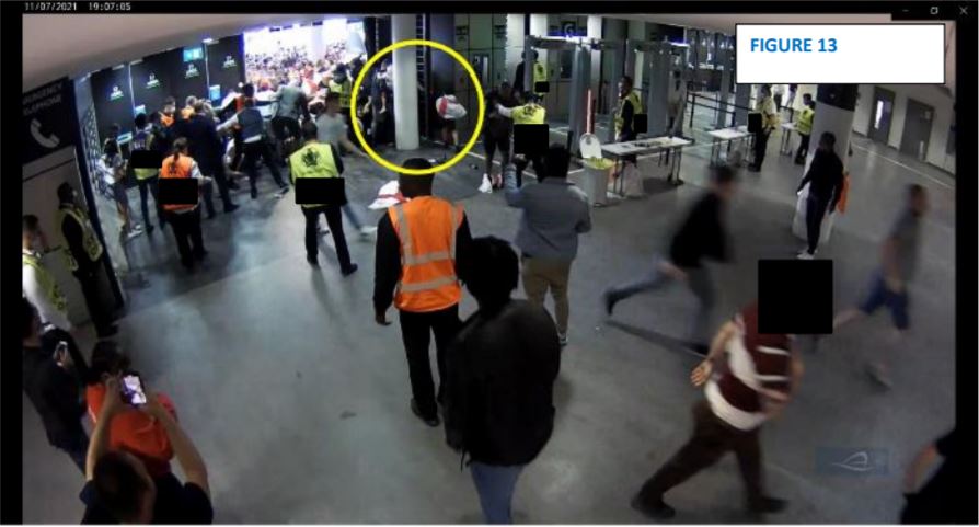 An image taken moments later shows the same man holding a young child, with a slightly older child in a white England shirt to his right. Eric Stuart said the man was trying to rescue a third child who was embedded in the crowd