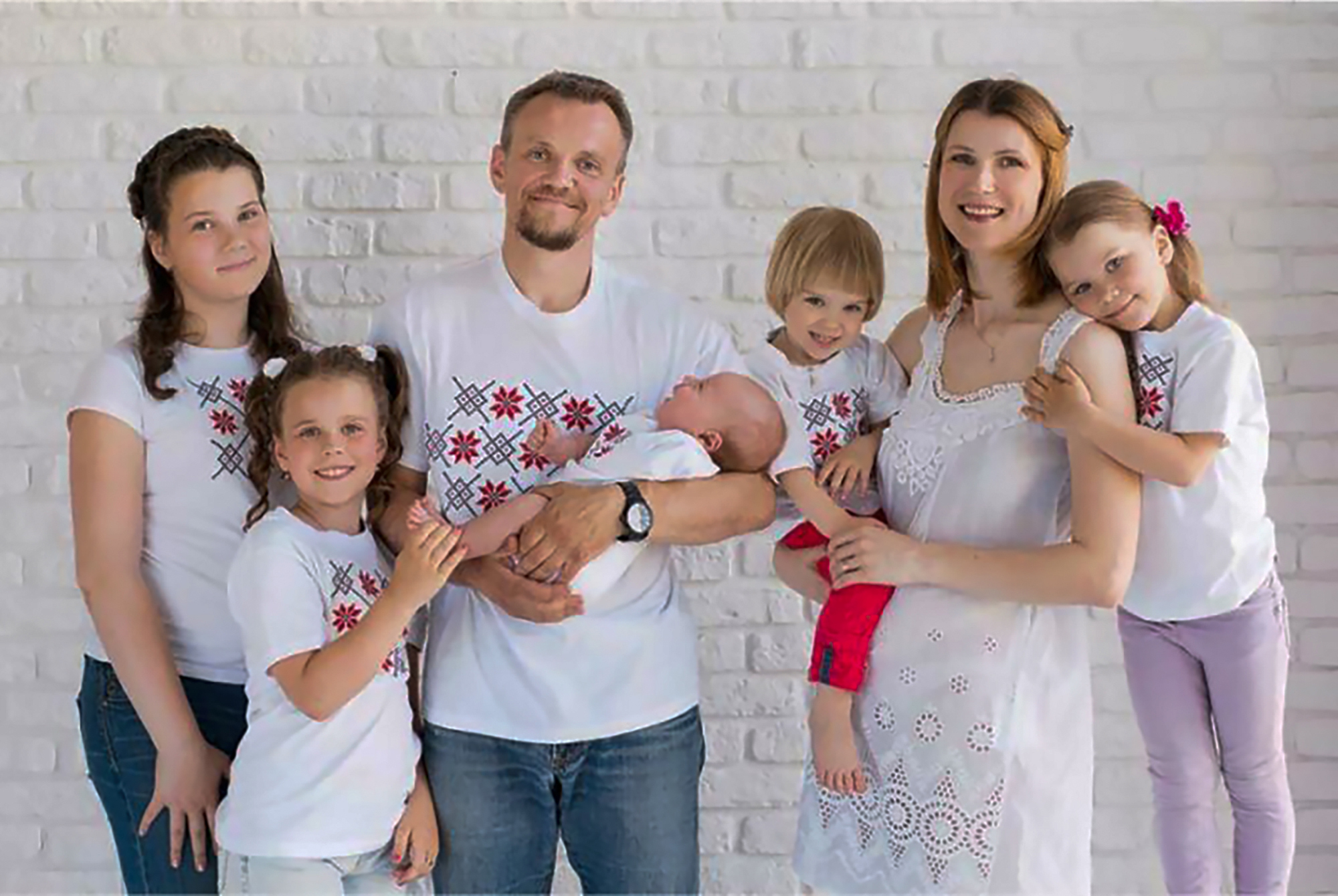 Volha Zalatar with her husband Sergei Gankevich and their children