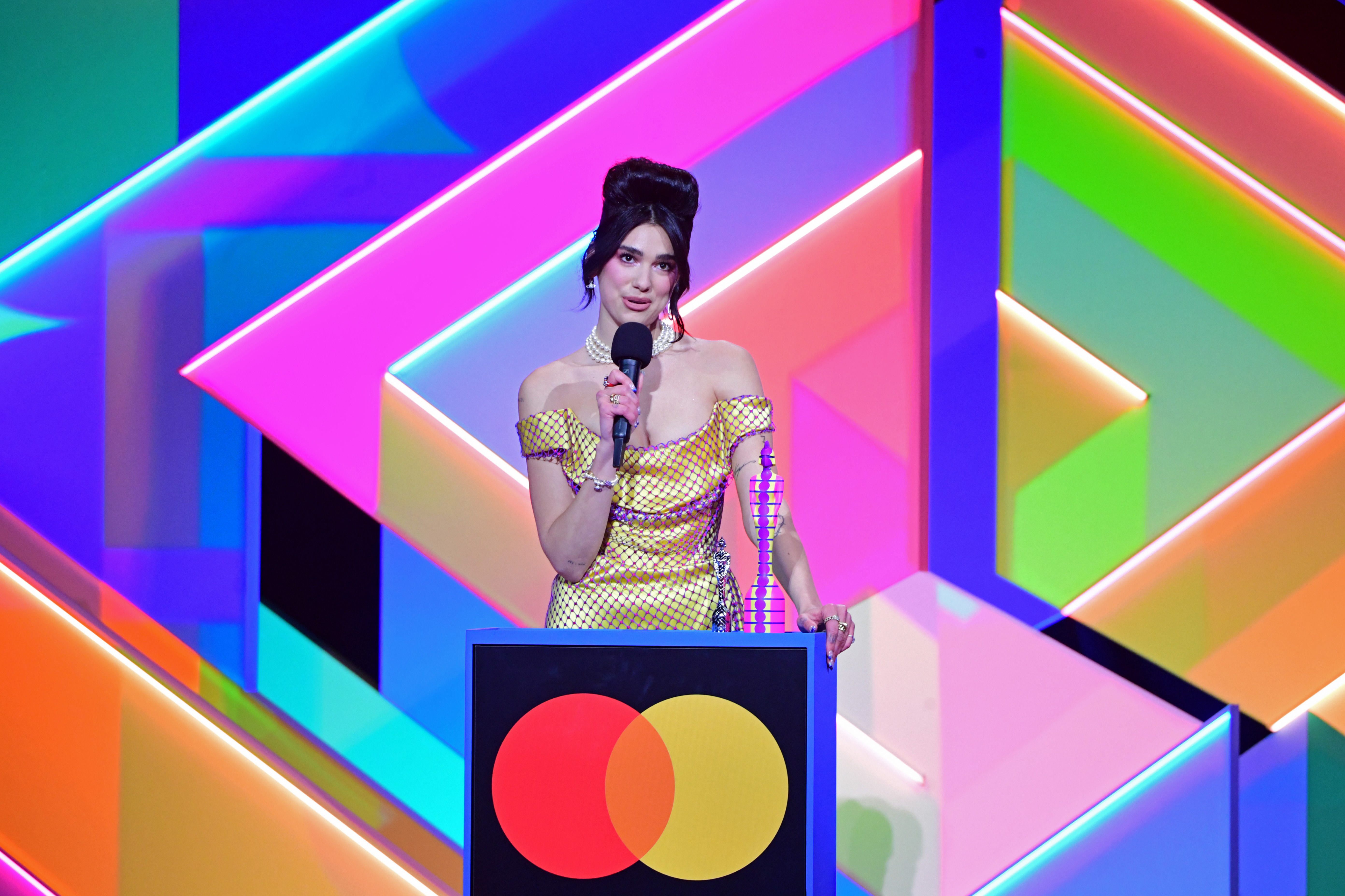 Dua Lipa accepts the award for Best Female Solo Artist at the Brit Awards