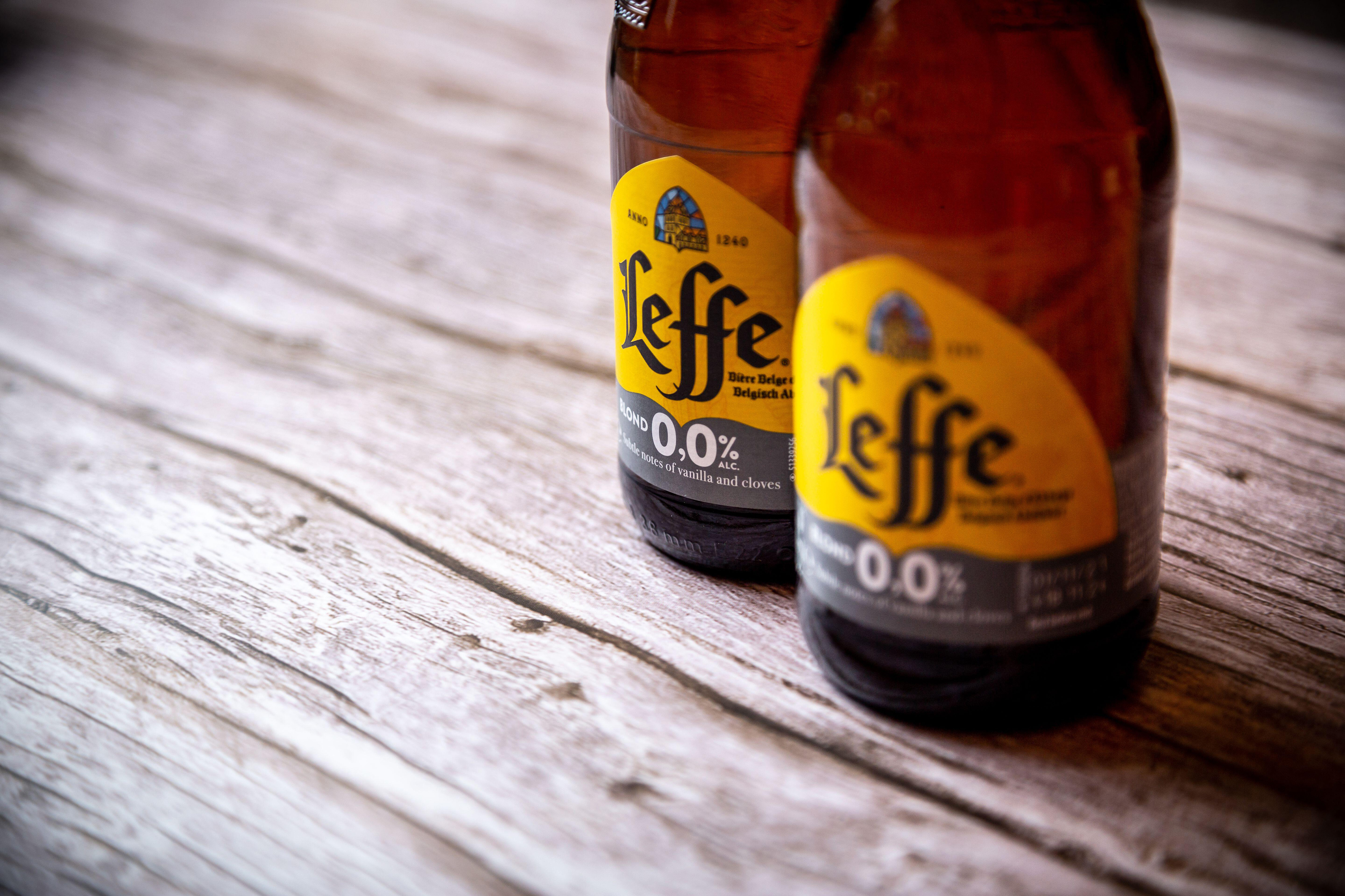 A close up of the labels of leffe zero alcohol beer bottles