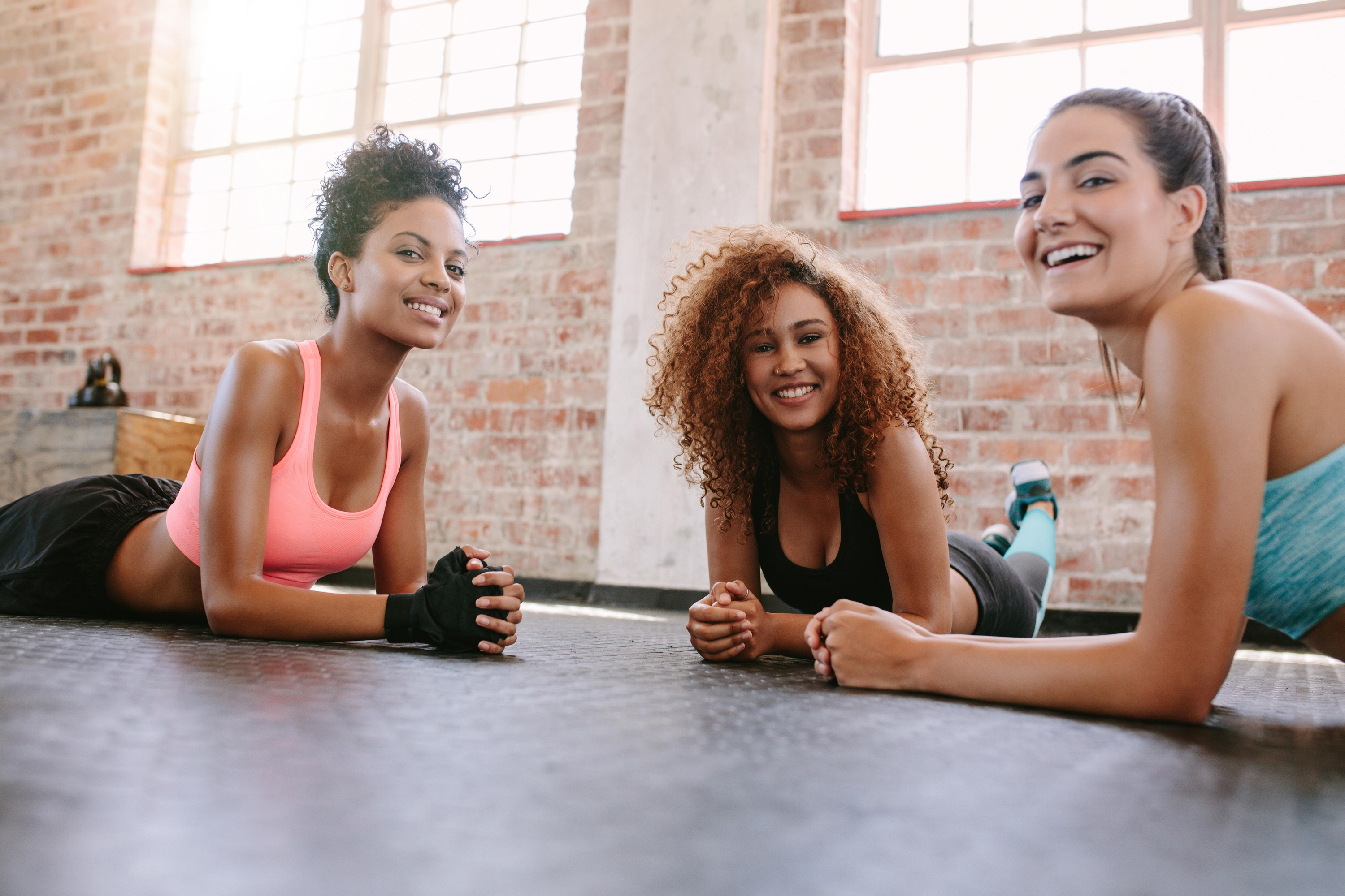 Portrait of three young women in fitness class