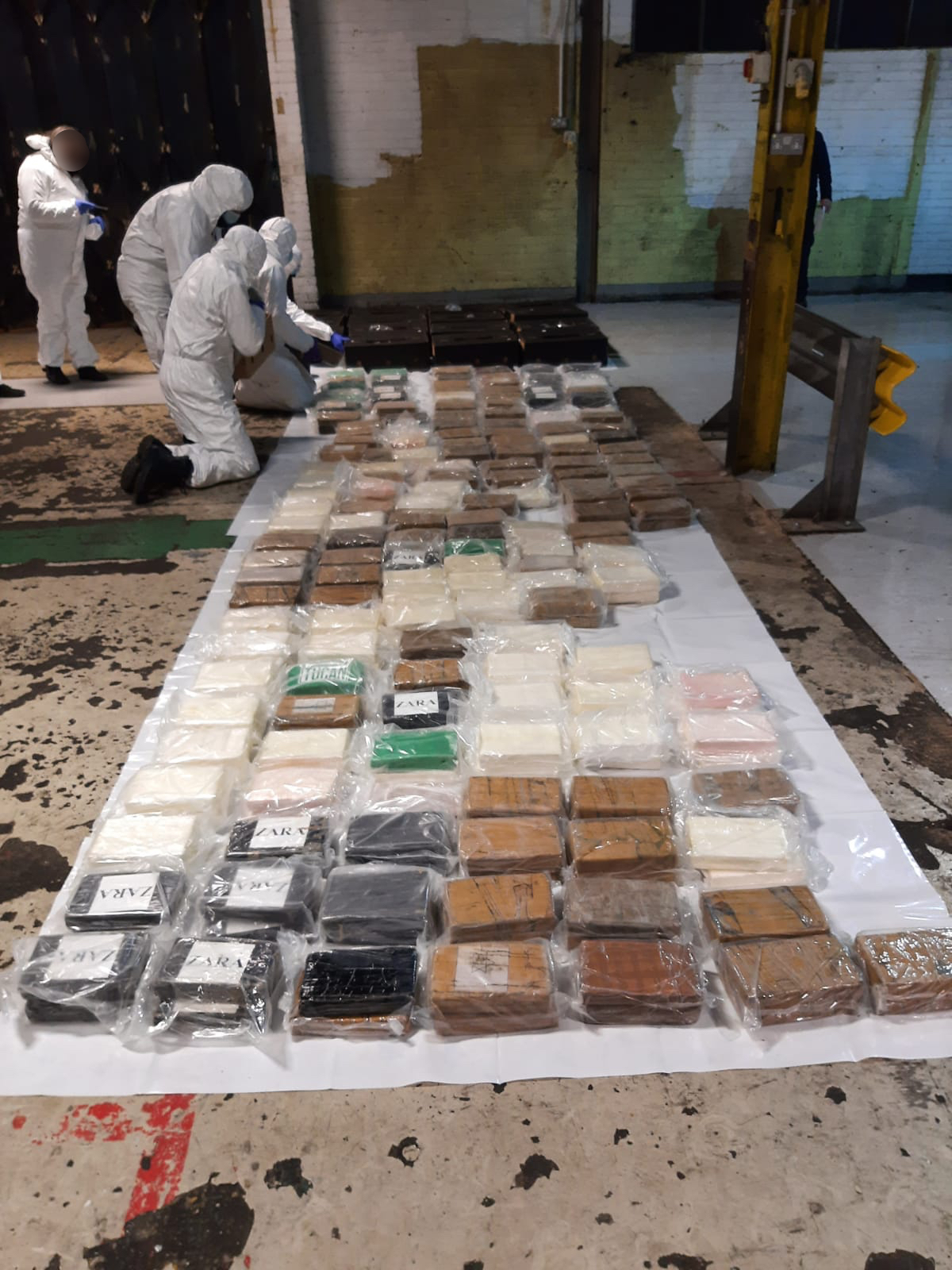 Investigators working at the site after the raid that led to seven arrests and the seizure of 1.2 tonnes of cocaine in the early hours of Monday