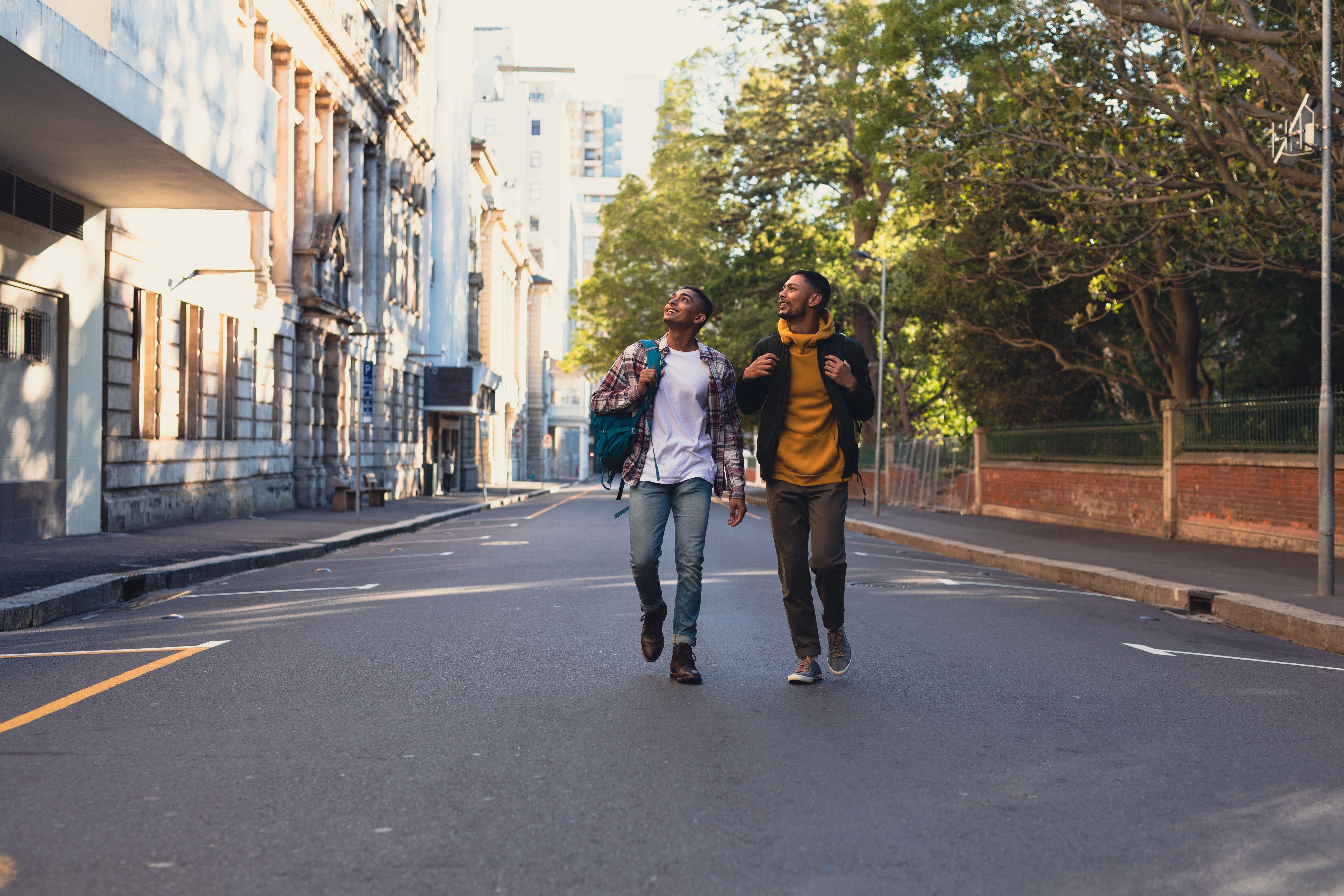 Two male friends walking together