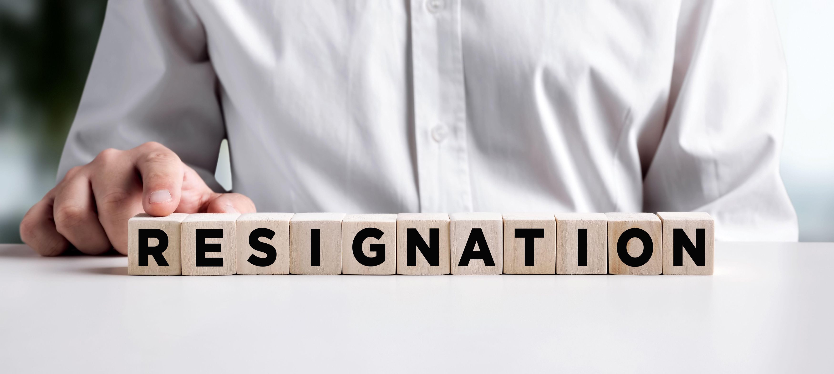 wooden cubes spelling the word resignation