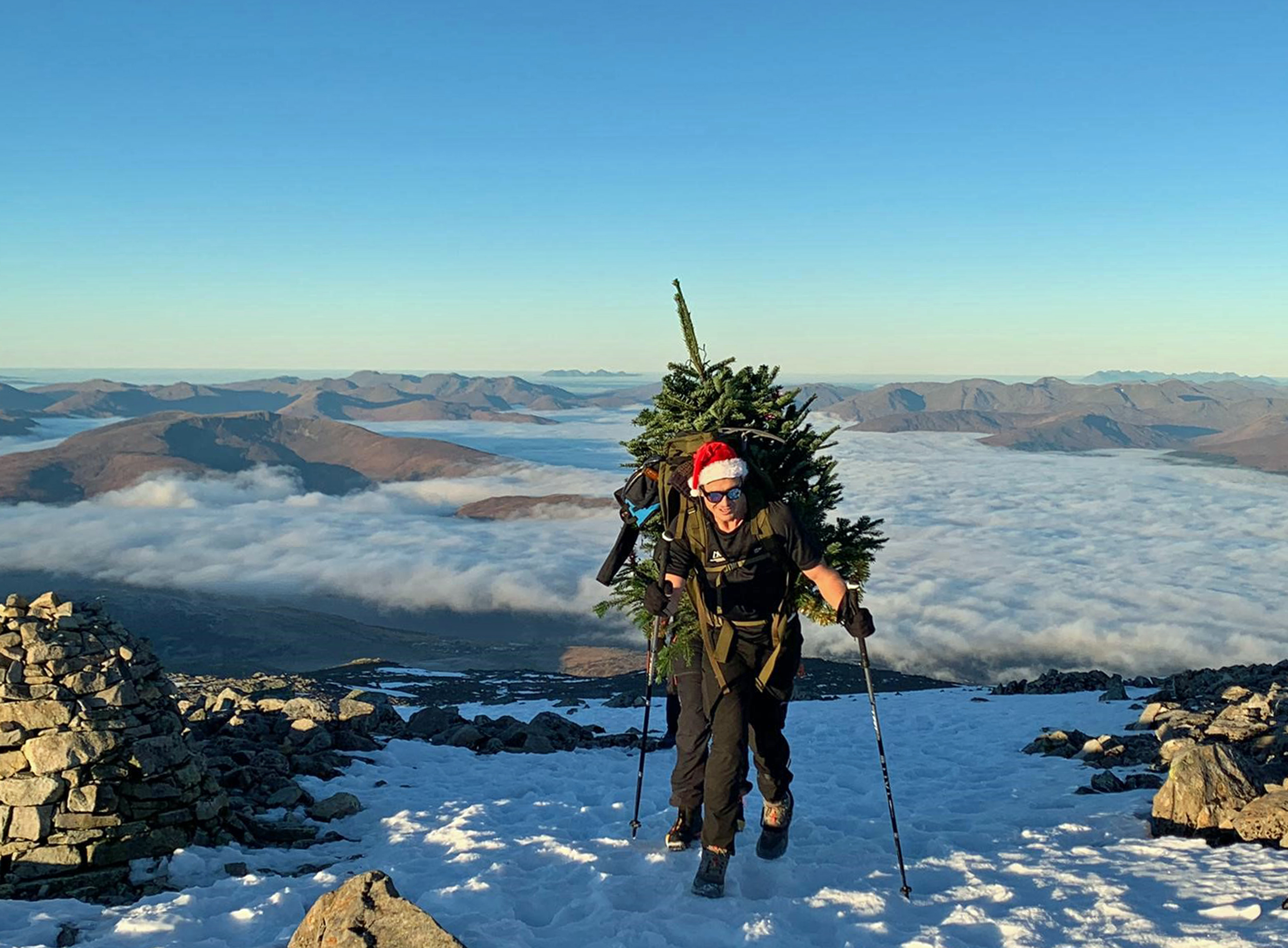 Ed Jackson carrying Christmas Tree up Ben Nevis