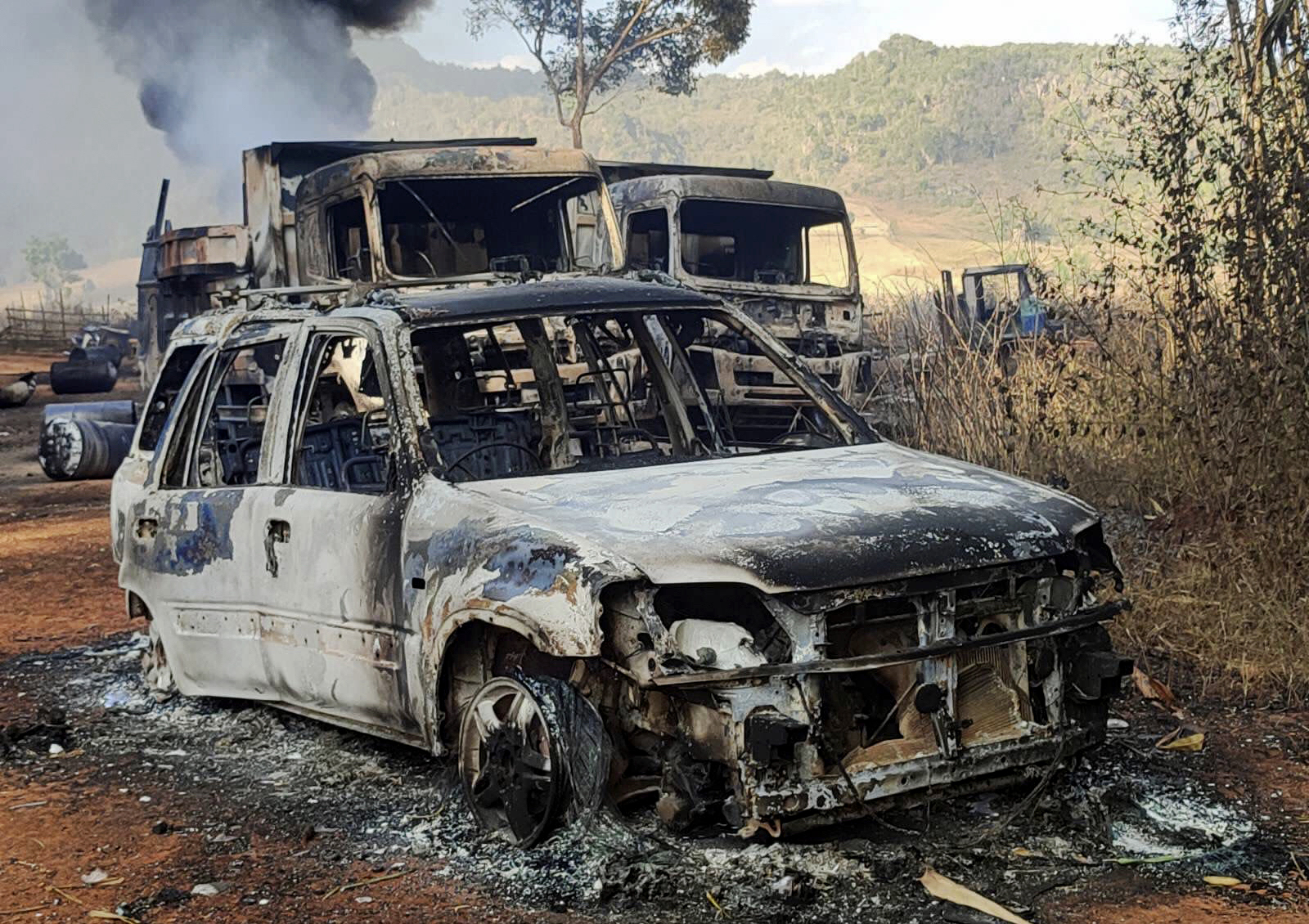 Vehicles smoulder in Hpruso township, Kayah state, Myanmar, on Friday
