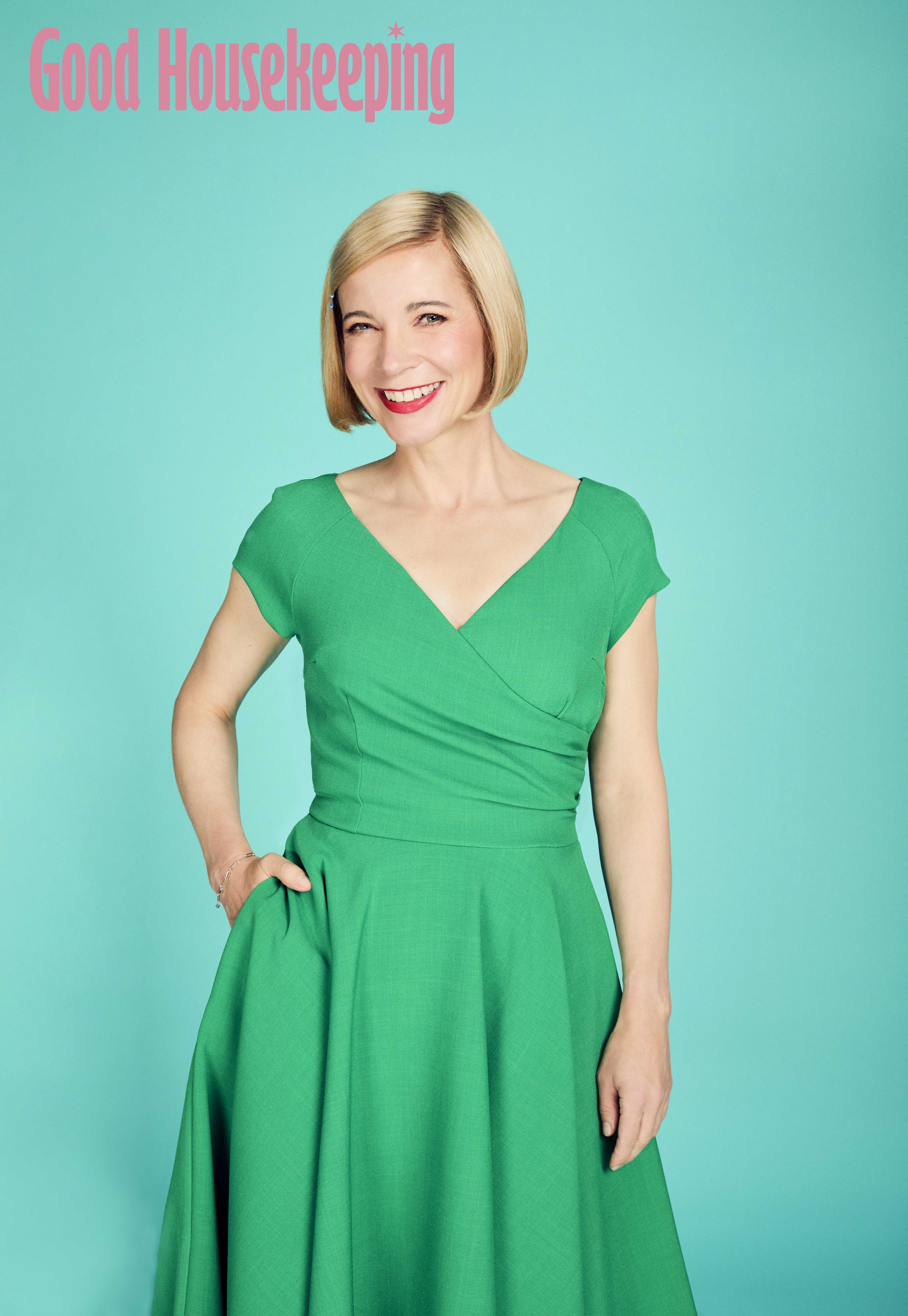 Lucy Worsley smiling, with her hand on her hip.