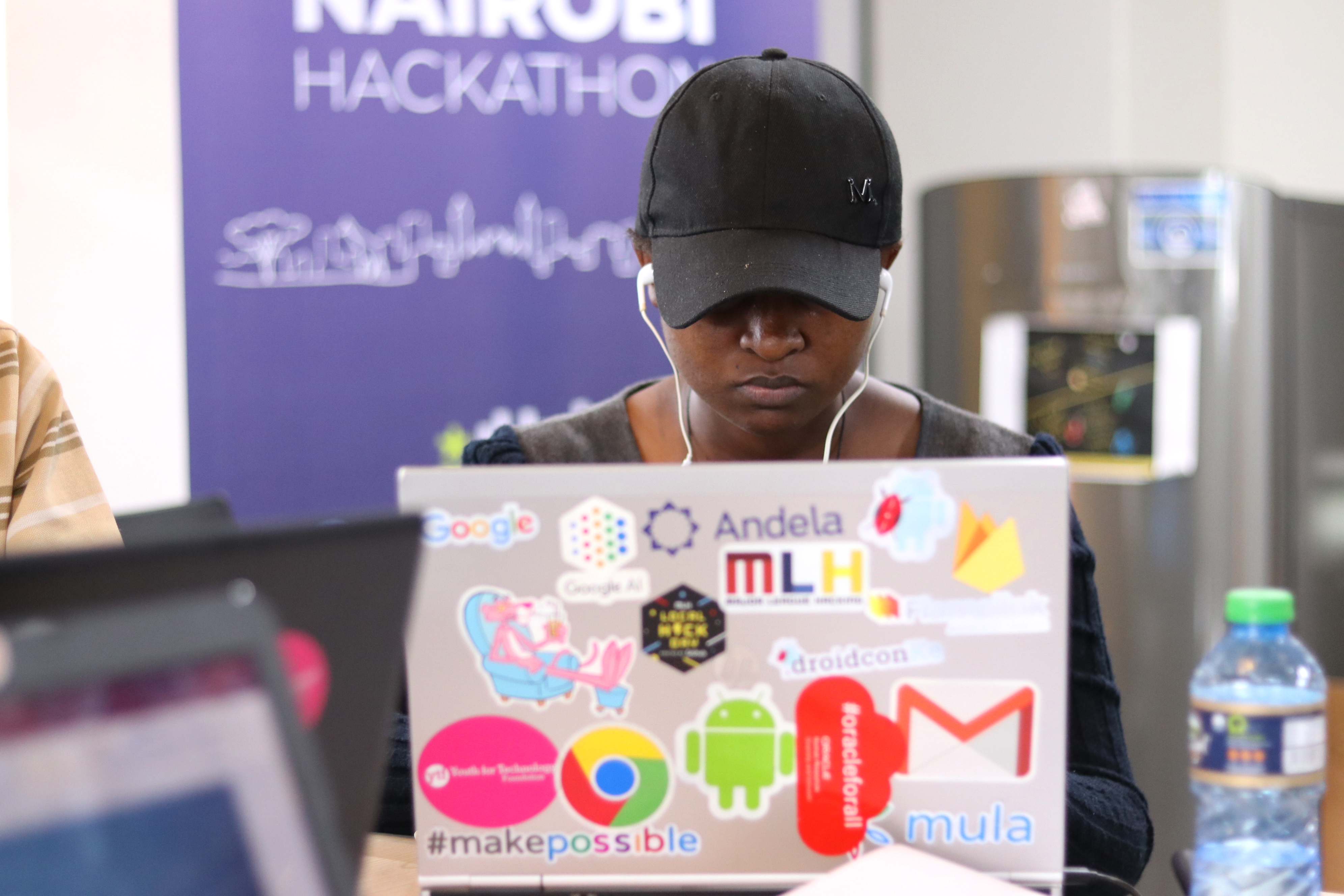 Techfugees worker sat at laptop