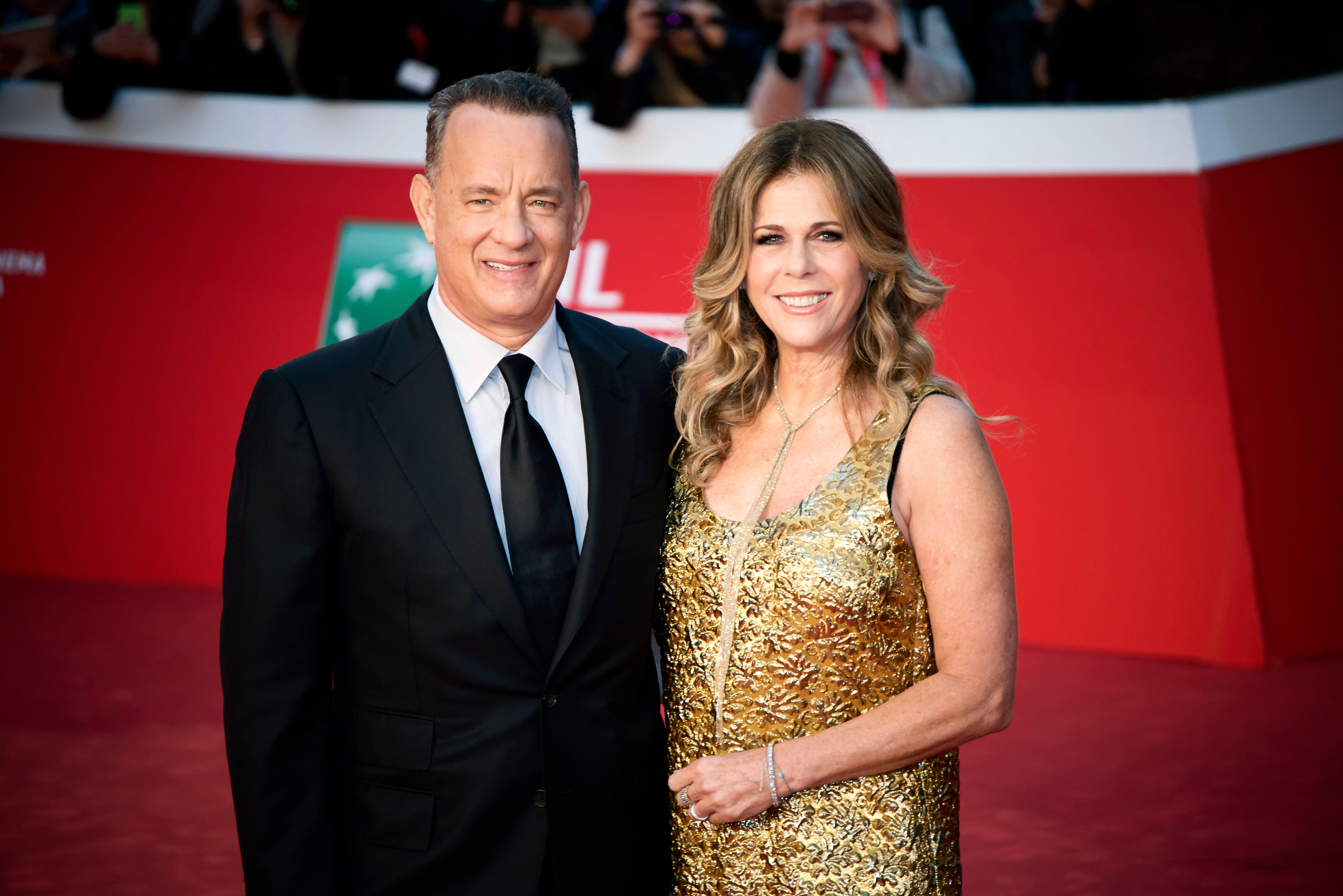 Tom Hanks and Rita Wilson smiling at the camera